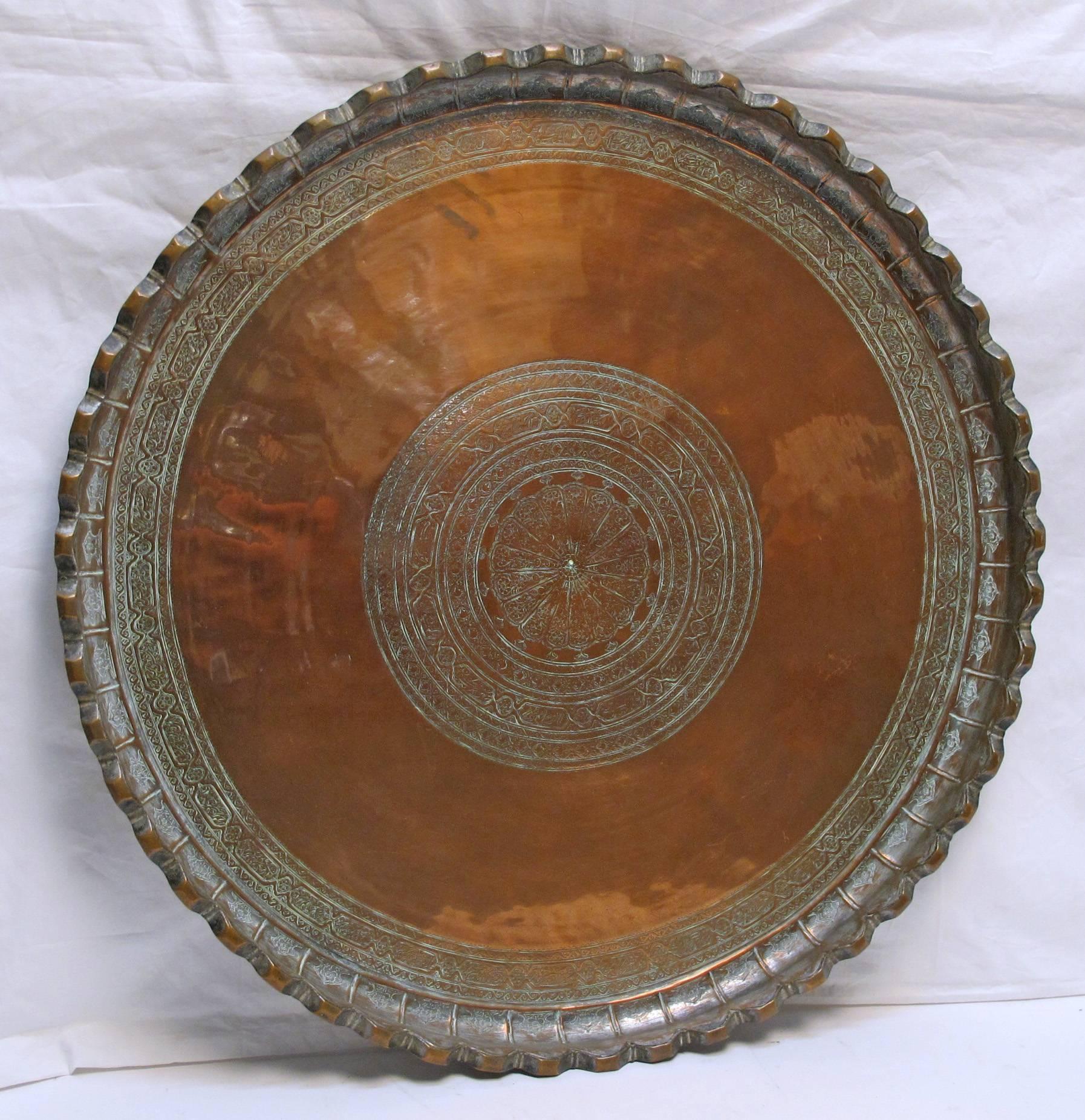 A large and heavy gage copper tray. Lovely quality well made tray (most likely this is not a tourist item).