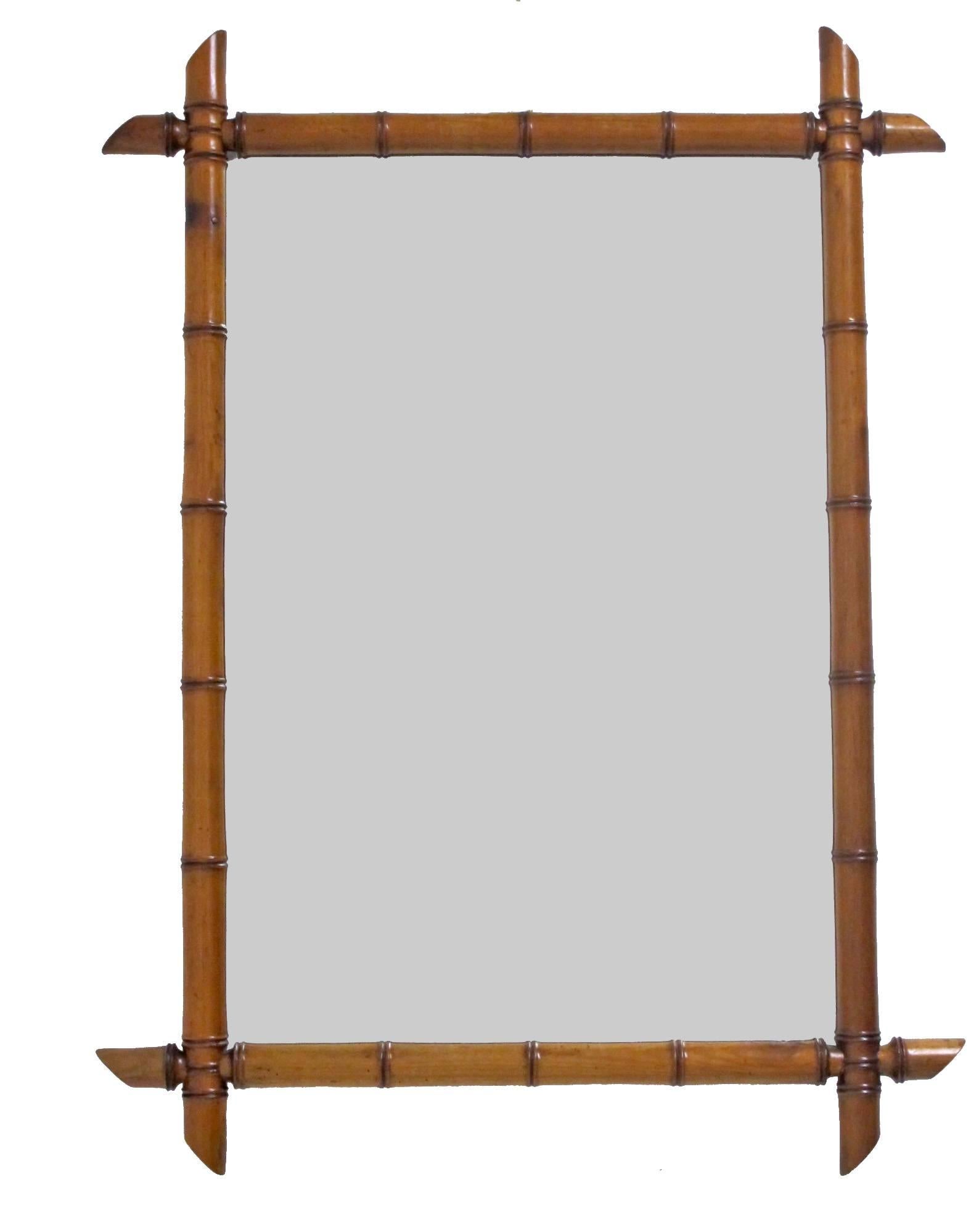 A Louis Philippe period mirror. Wooden faux bamboo style frame with newly replaced mirror. France mid-19th century.
