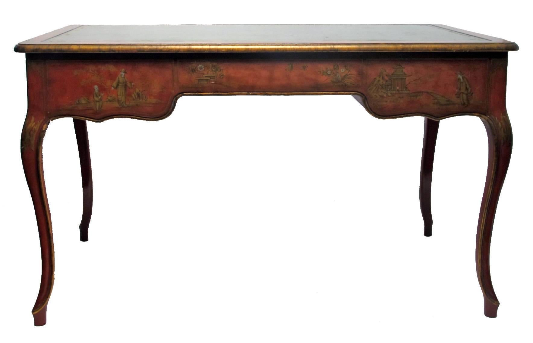 Baker, Knapp & Tubbs made writing table or desk with painted chinoiserie decoration and inset gilt tooled green leather top surface. Designed to float in a room, painted on all four sides. American made, 1940s-1950s.