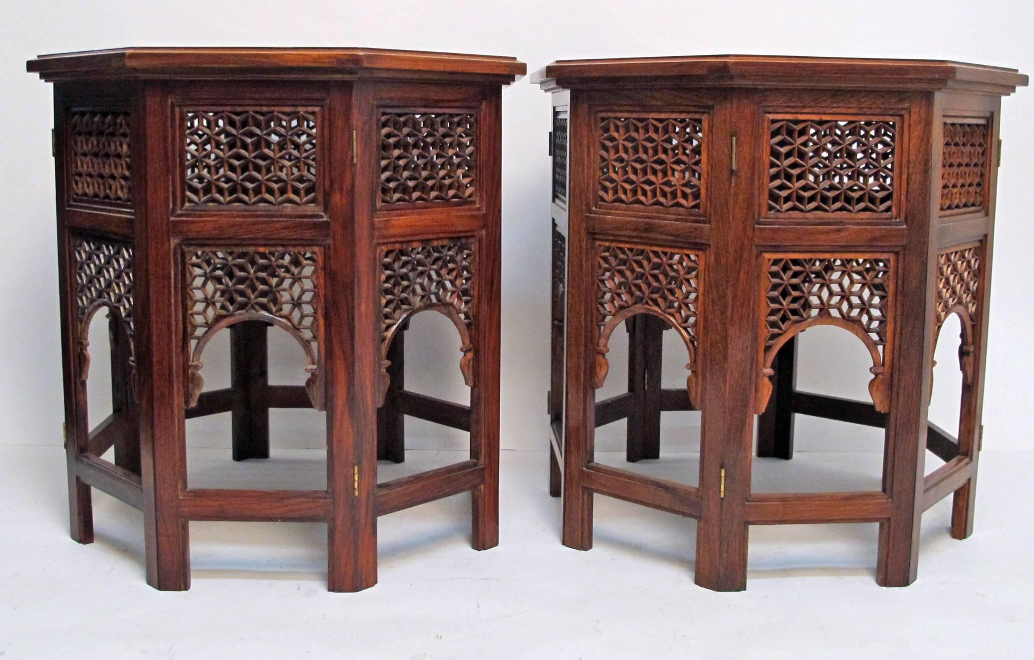 A pair of lattice work octagonal shaped side tables with brass inlay and glass covered lattice top. India, circa 1900.