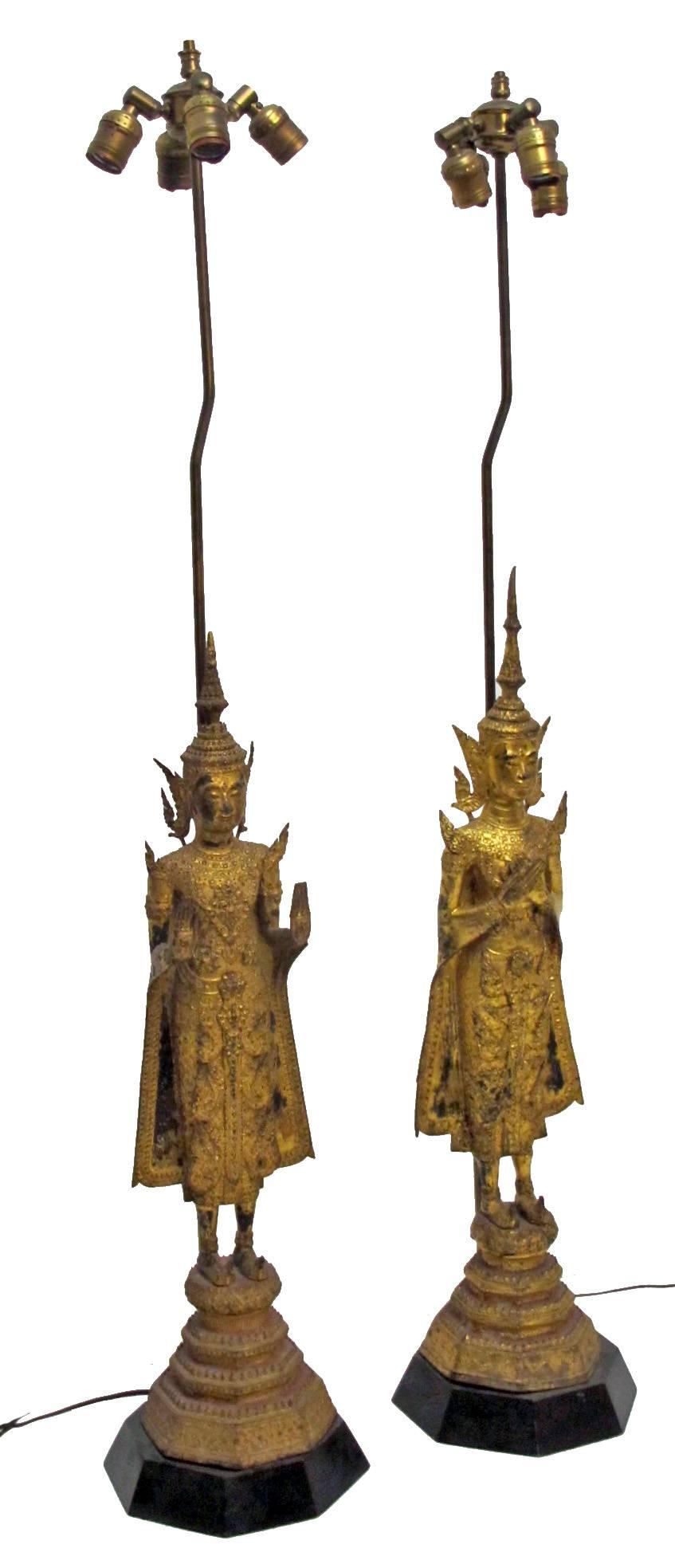 A large impressive pair of beautifully cast, lacquered and gilded bronze figures. Museum mounted on octagonal wood bases and converted to lamps in the mid-20th century (the bronze sculptures were not harmed or drilled in the process). Newly