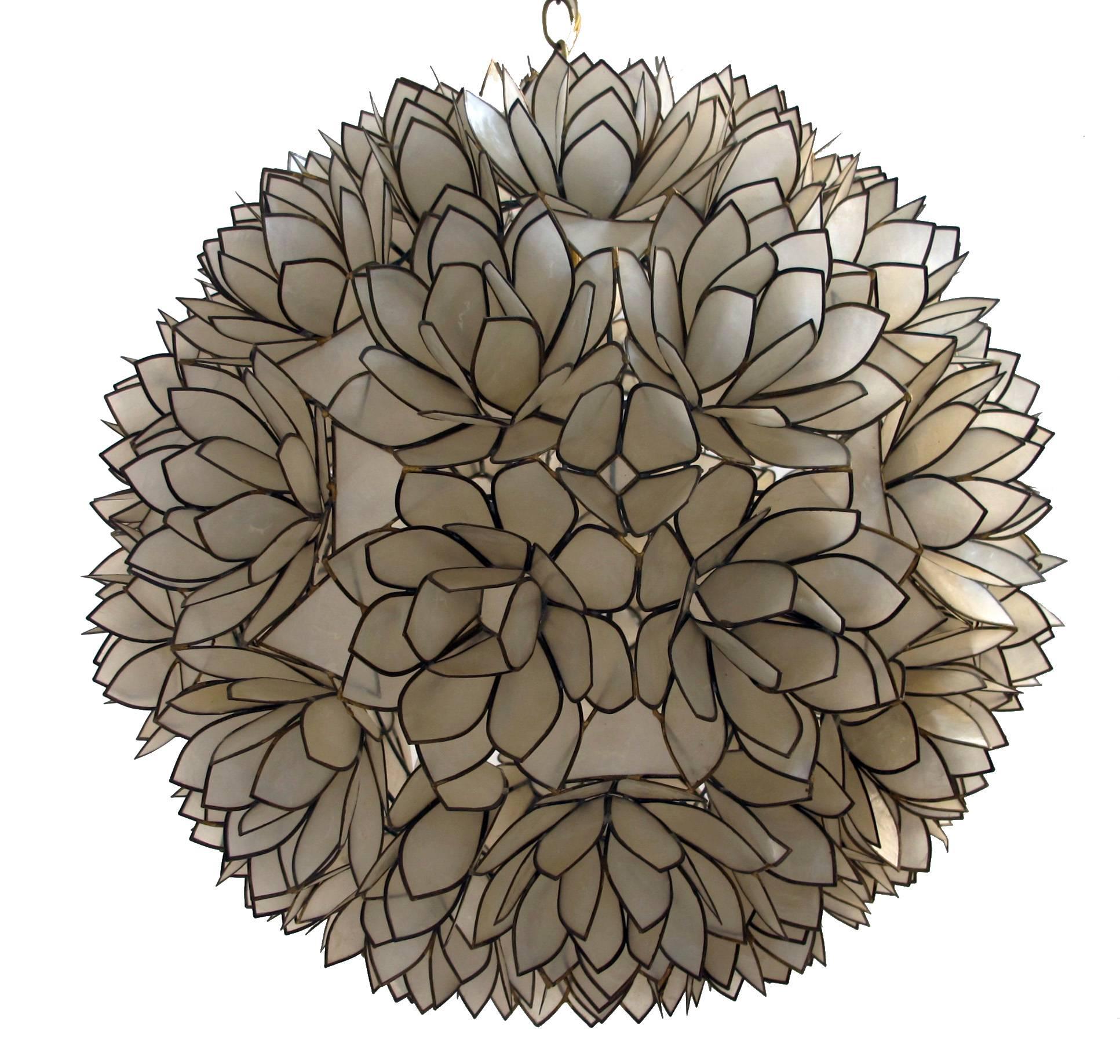 A mid-20th century large sphere shaped or flower form capiz shell hanging pendant light fixture. Newly re-wired and ready for installation. The chain can be shortened or lengthened at no extra cost. Measurements below are for the sphere only.