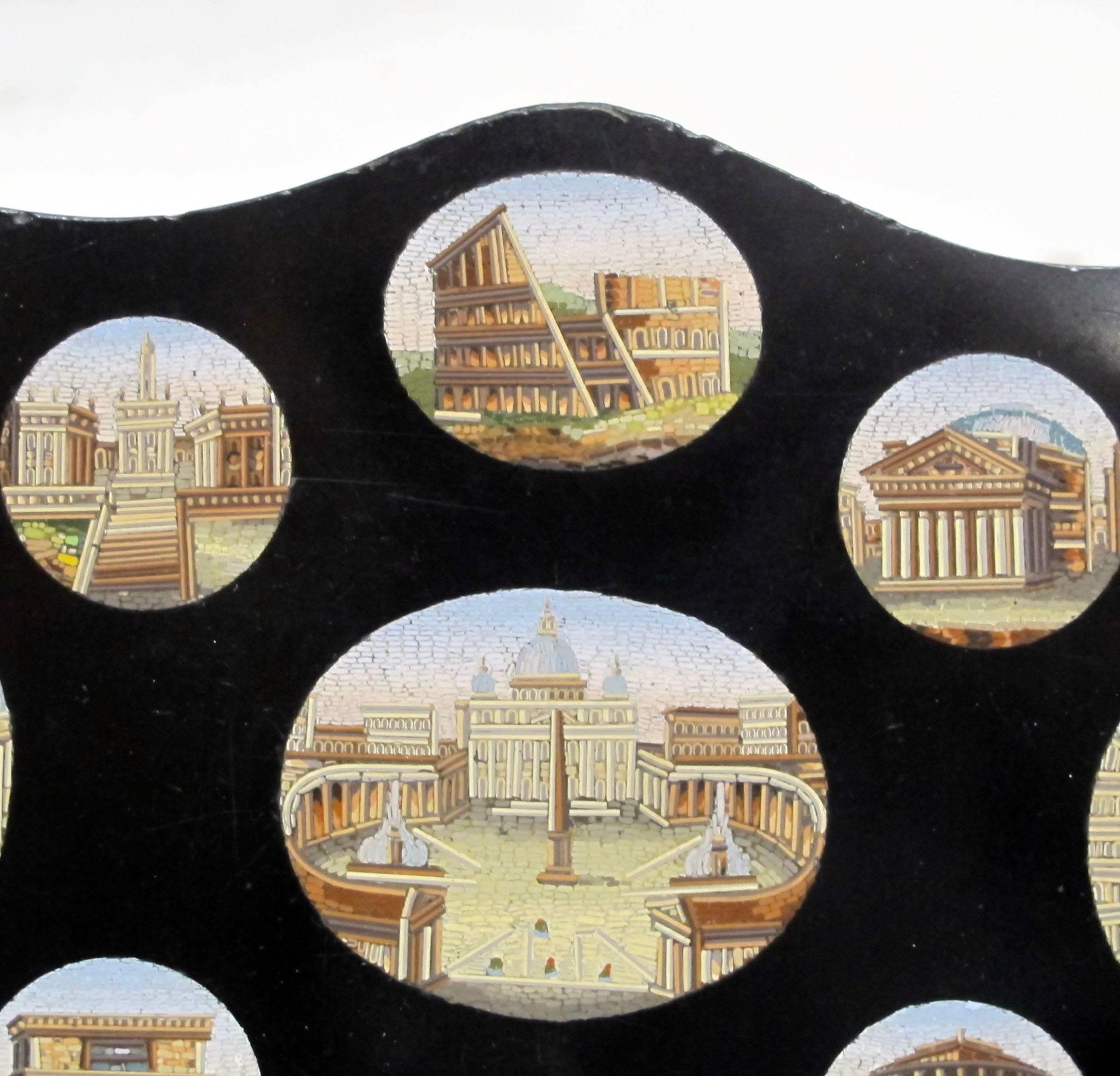 Grand tour plaque having nine oval very fine tesserae micro mosaic panels of Roman views set into a slate tablet, Italy, 19th century.