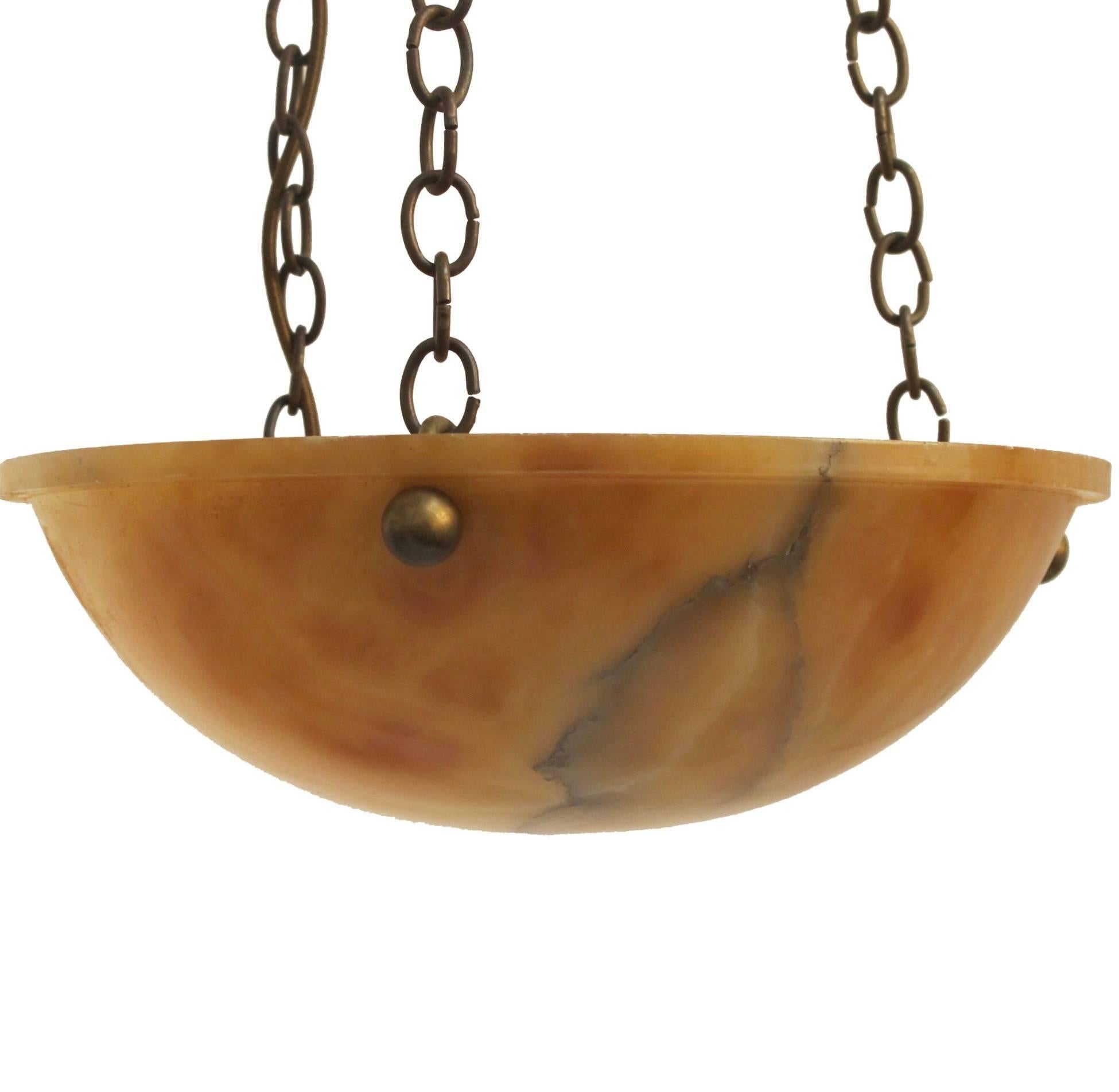 A small size amber alabaster bowl hanging light fixture. Recently re-wired.