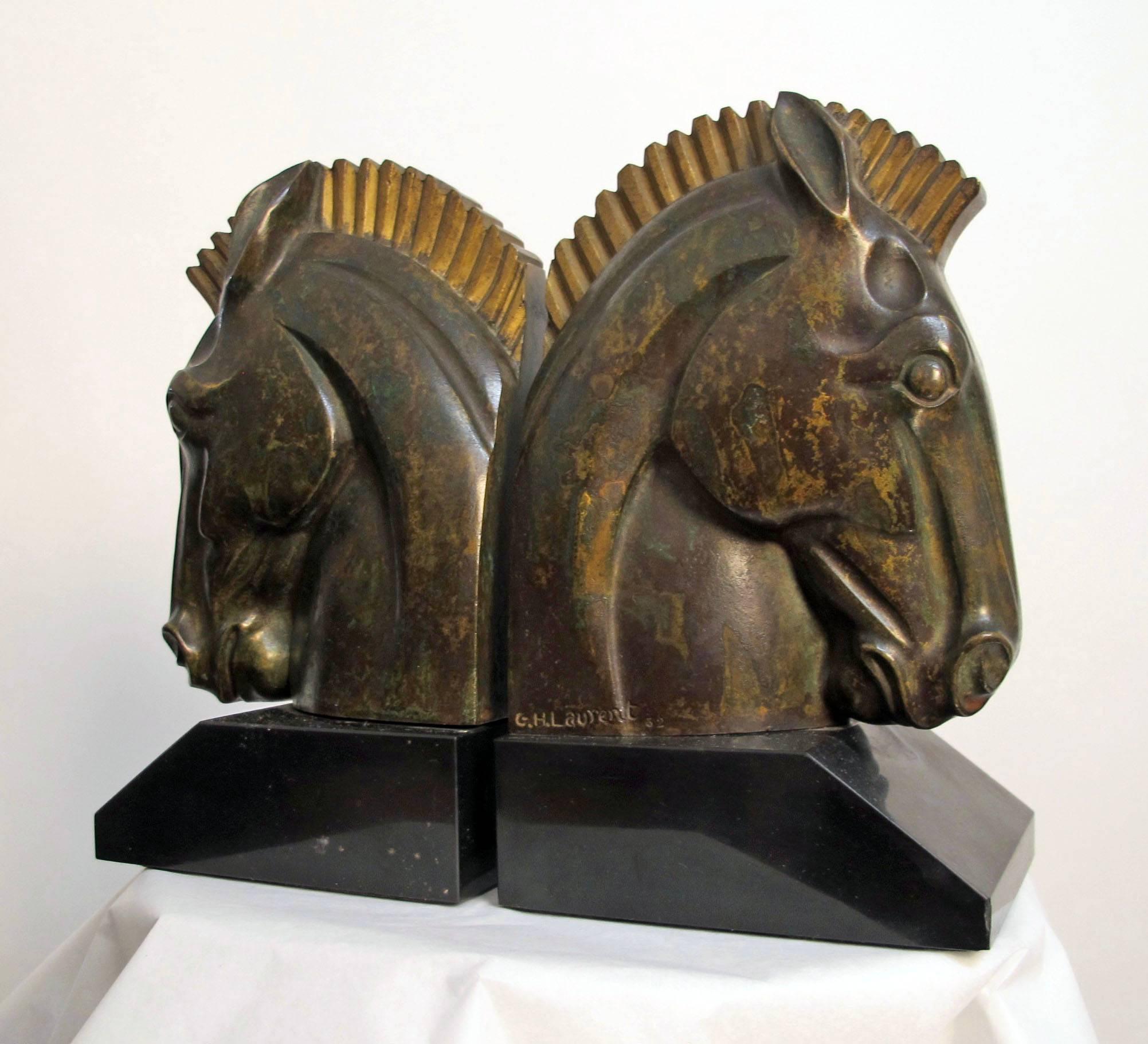Art Deco bronze horse head bookends on polished slate bases. Signed G. H. Laurent and numbered, France, 1920s-1930s.