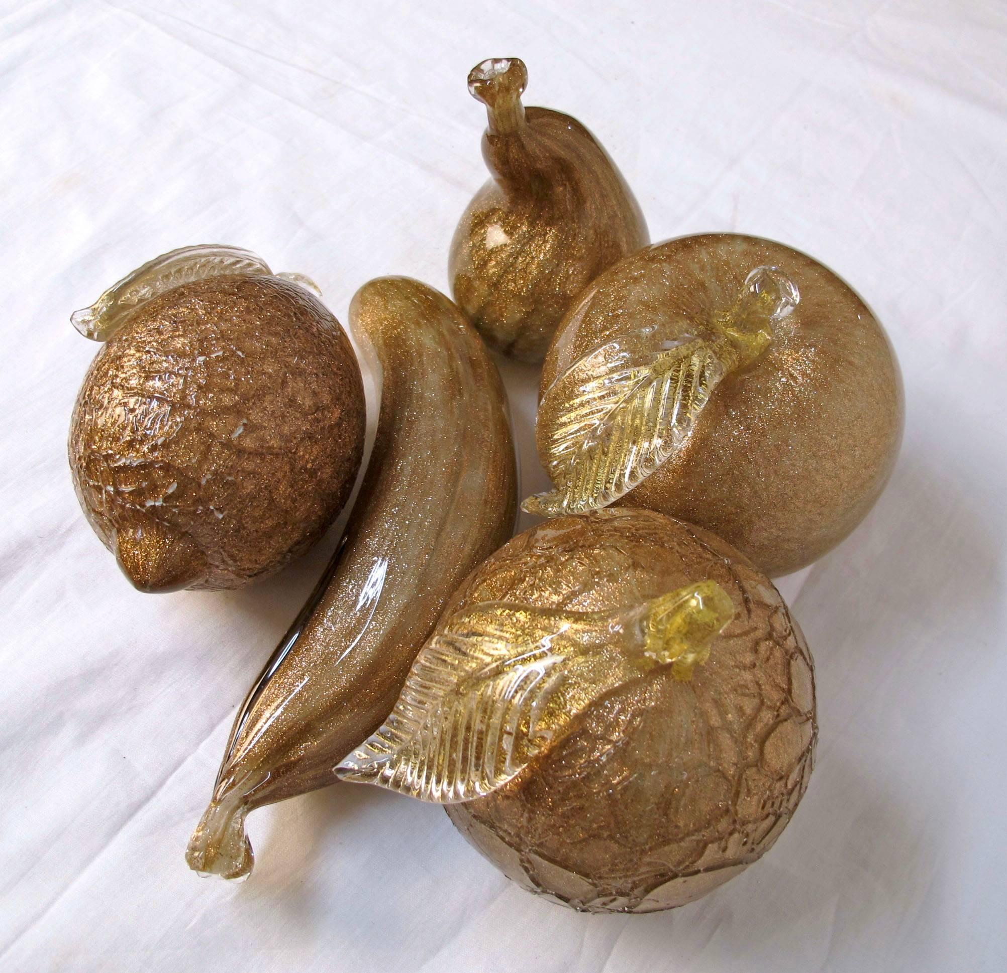 Large handblown art glass fruit with heavily bronzed gold flecks attributed to Alfredo Barbini. Group consists of a banana, pear, lemon, apple and an orange (or maybe a peach). The orange and the lemon have a crackle texture, Italy, circa 1950s.