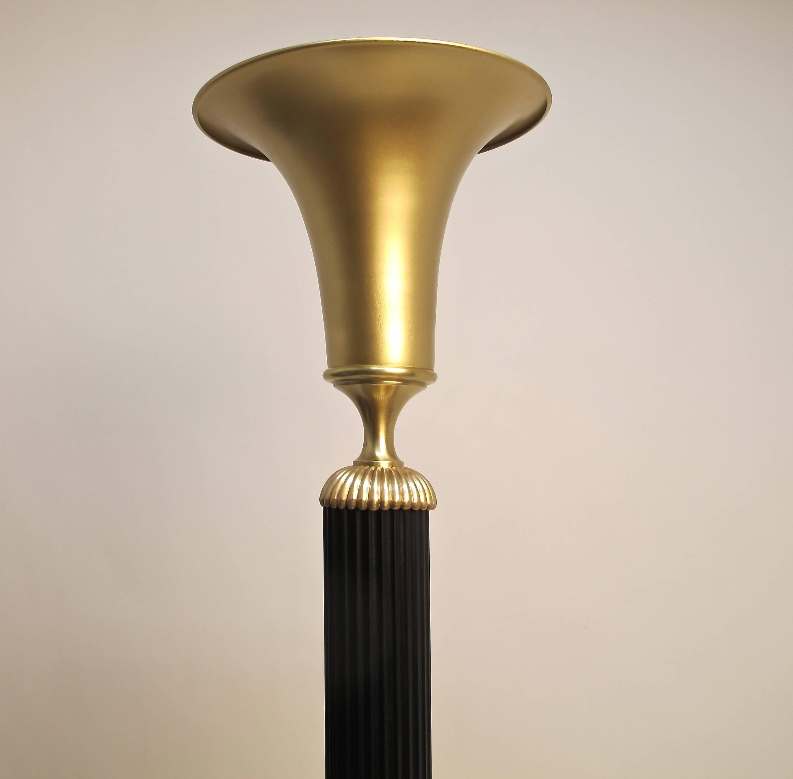 A pair of striking Art Deco style painted brass and steel torchiere floor lamps. Completely re-conditioned and re-wired, holds a single standard size light bulb, American, 1930s.