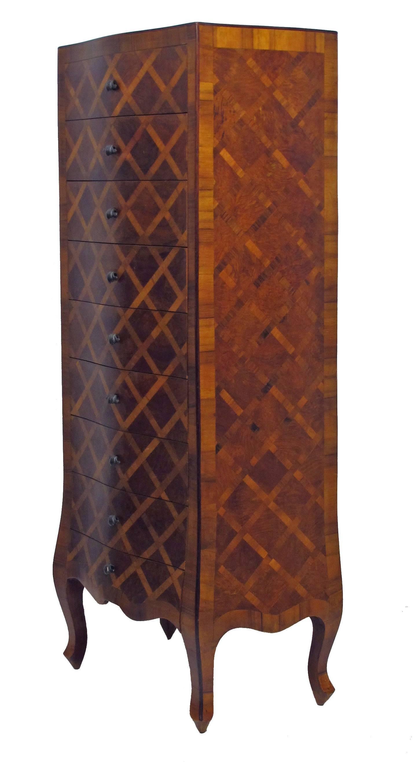 Walnut and Burl Walnut chest of drawers with inlaid parquetry design, having scroll handles and standing on cabriole legs, Italy, mid 20th century.