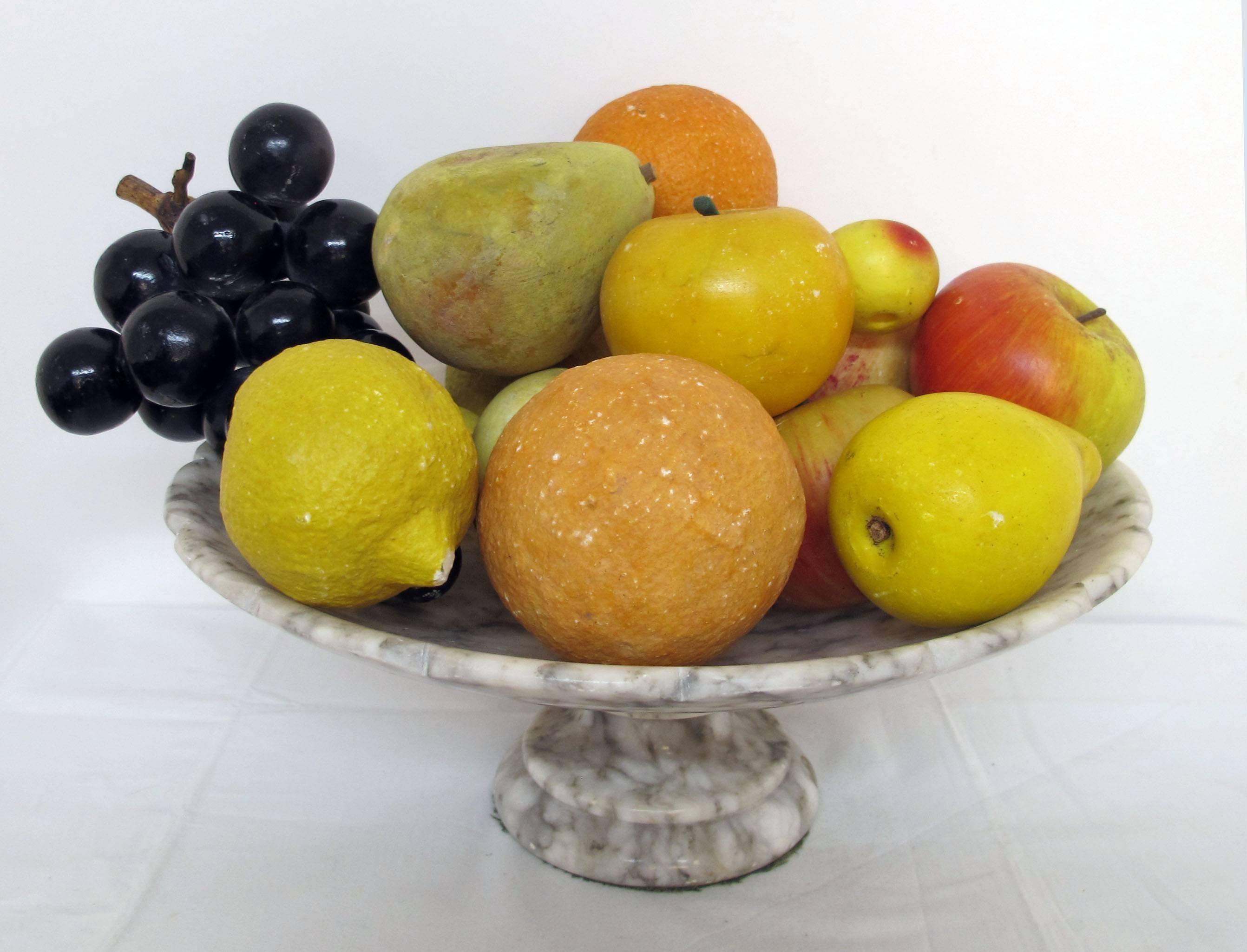 Grey and White veined scalloped shaped marble bowl with twelve marble and alabaster fruits.  Italian, Mid 20th. Century.
