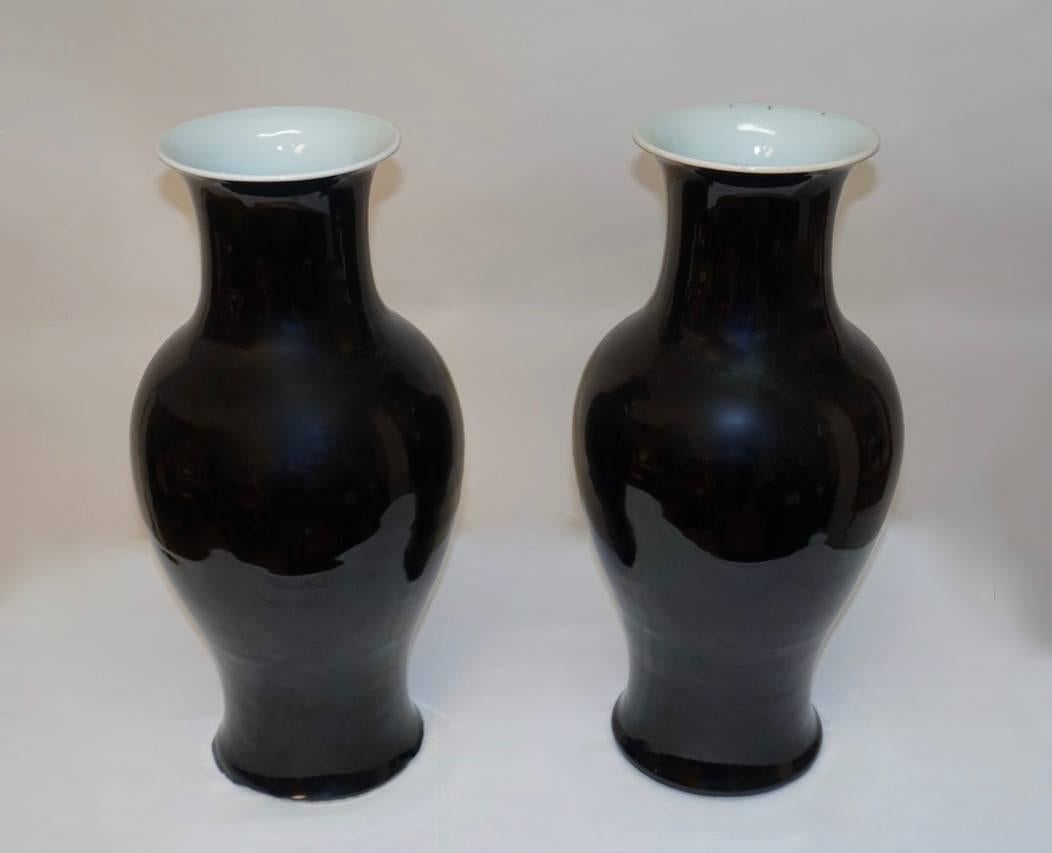 Pair of ovoid shape vases with mirror black glaze, marked on the underglaze blue with double rings around six characters. China, Kangxi period, 19th century.