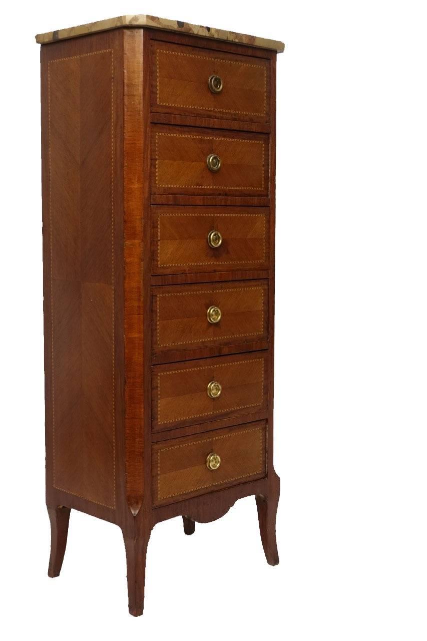 Fancy veneered six-drawer chest in the Louis XV style, having satinwood and ebony inlay around the drawer fronts and breche marble top, France, circa 1920.