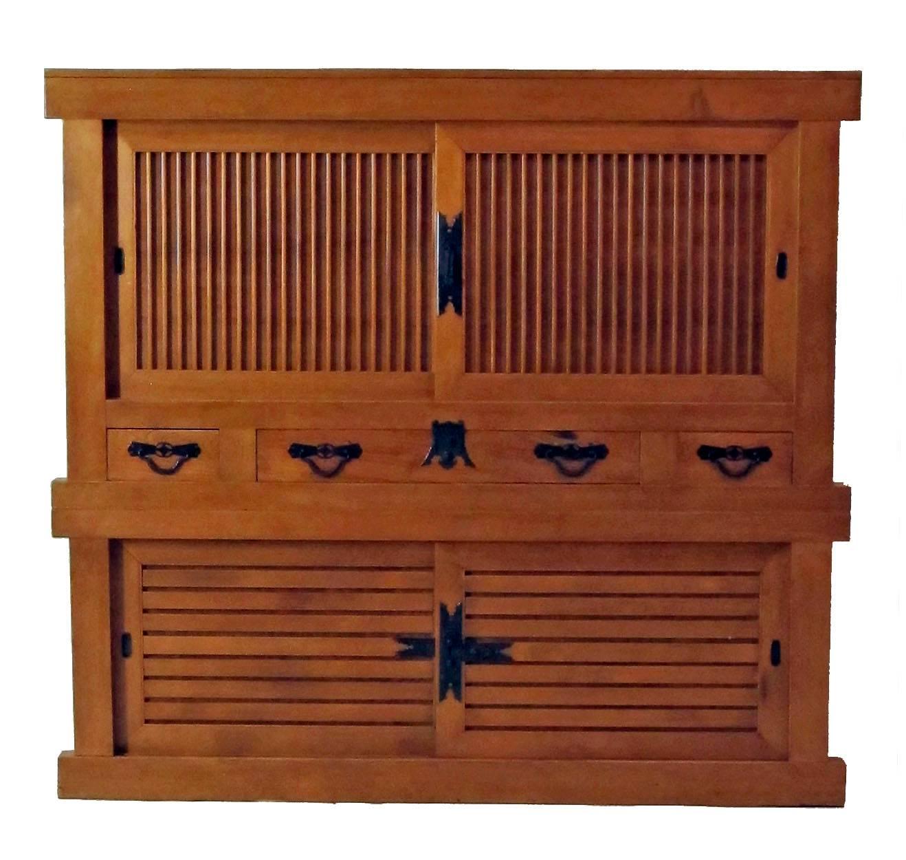A two section cypress wood futon tansu with original steel hardware in remarkable restored condition. The interior depth of this cabinet measures 23 inches. Japan, Meiji period, late 19th-early 20th century.