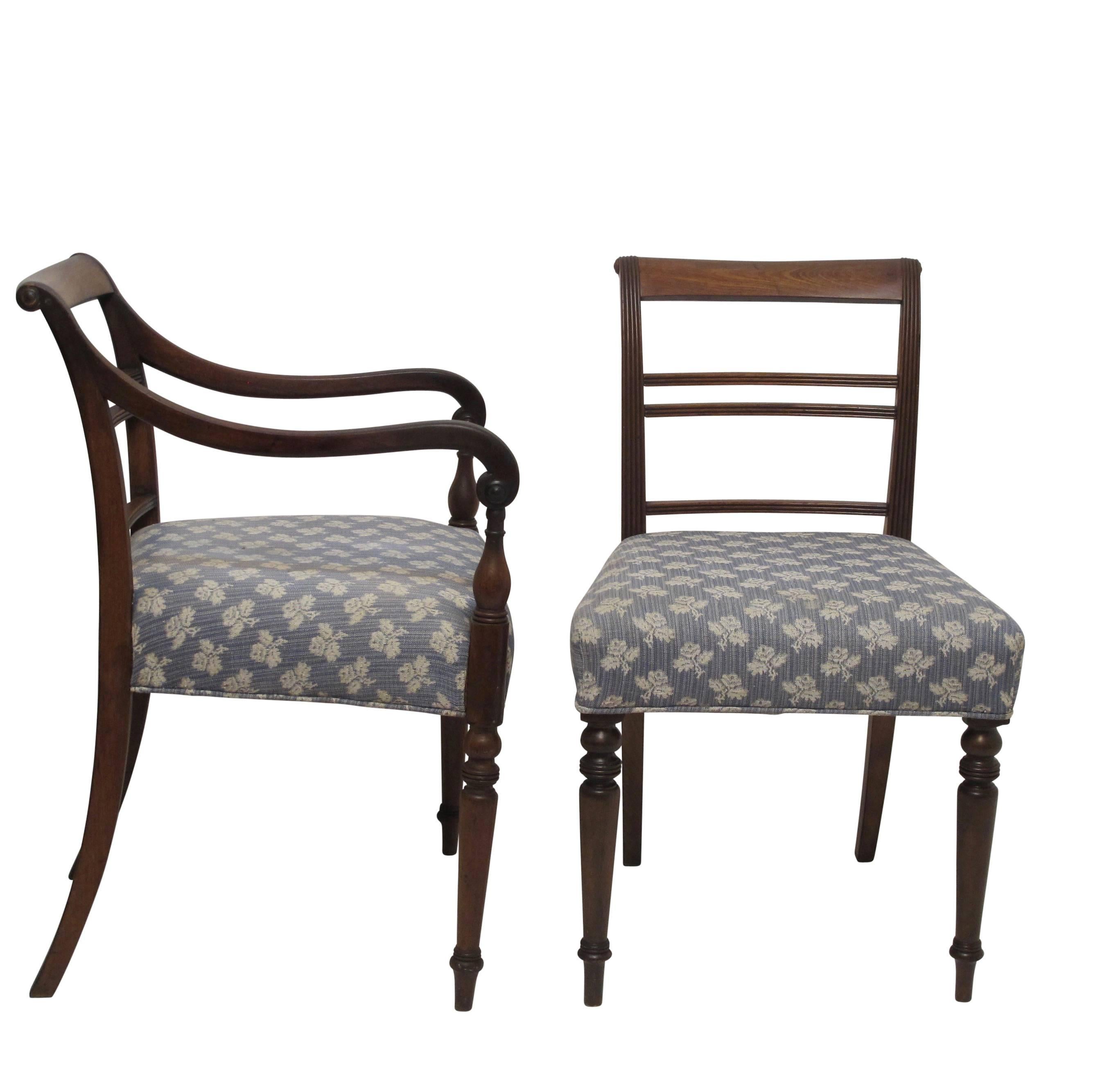 A set of eight Regency period dining chairs, two armchairs and six side chairs. Original solid walnut chairs with reeded backs and arms on turned legs. Ready for new upholstery. England, circa 1840.
Armchairs measure 33.5 inches high x 21.75 wide x