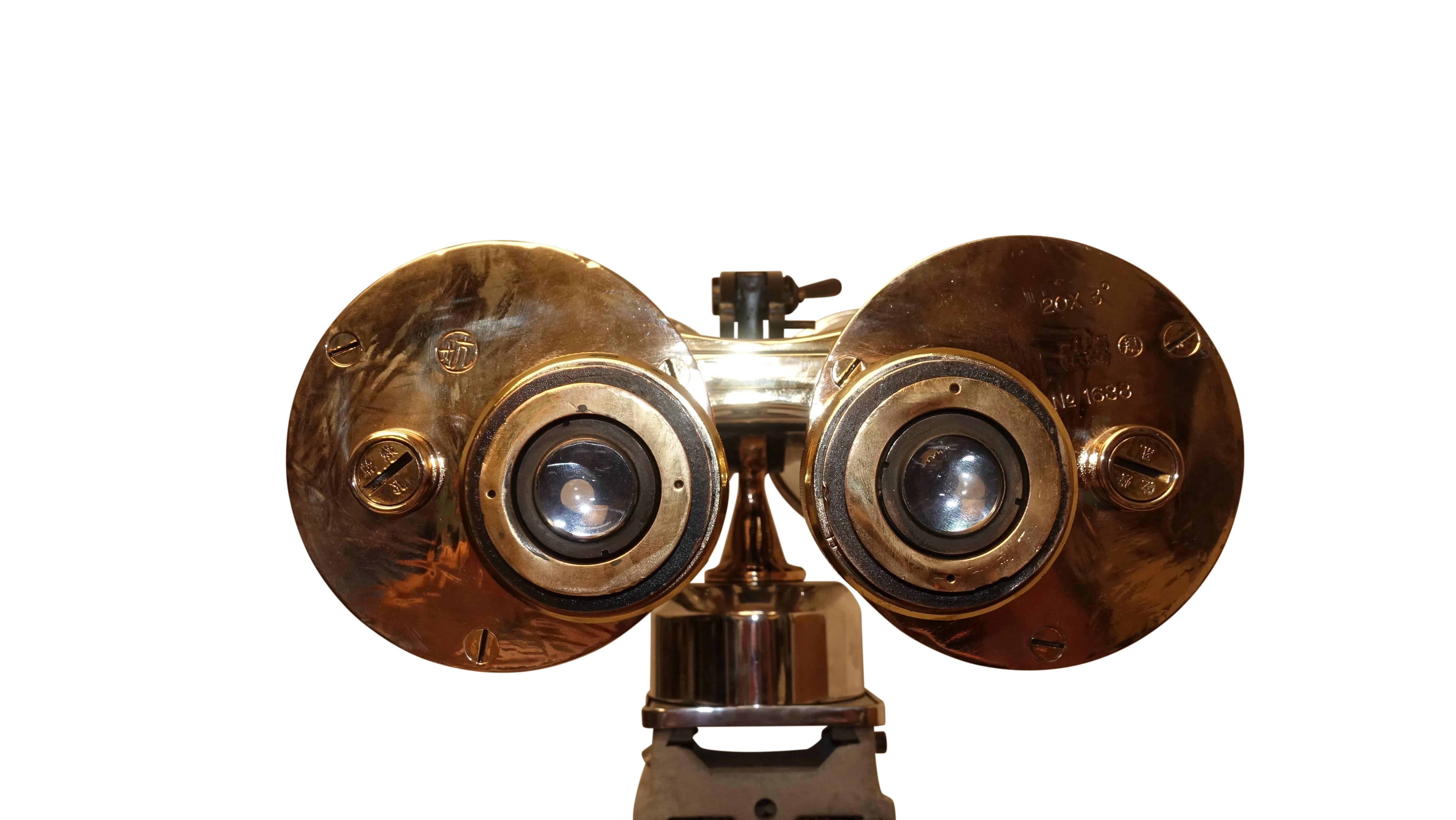brass binoculars on stand