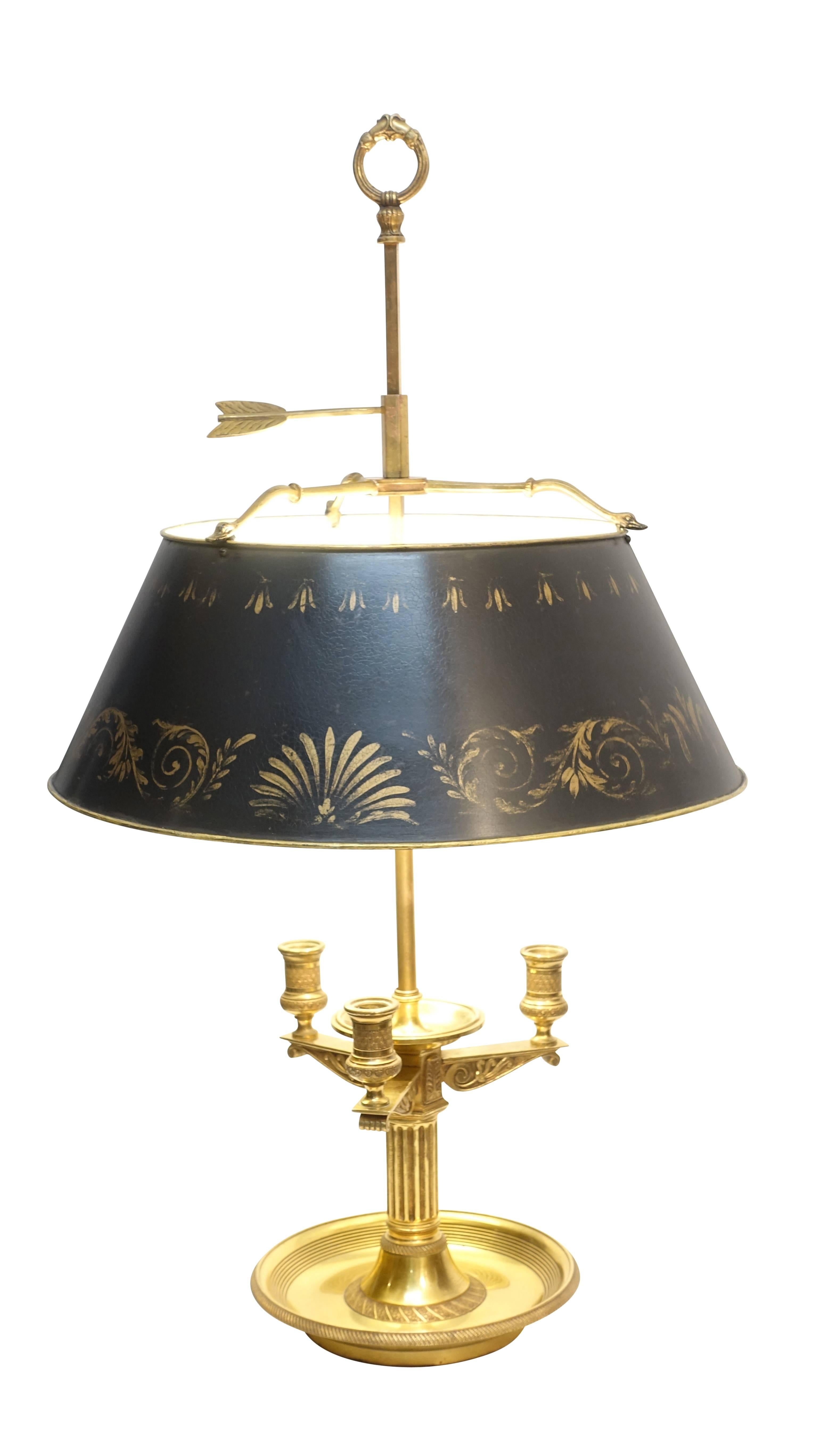 Beautiful quality brass bouillotte lamp with gilt decorated metal shade. Fine details throughout, swan heads holding the tole painted shade and corbel style candle arms. Recently re-wired with a high-lo switch on the cord as well as direct on/off