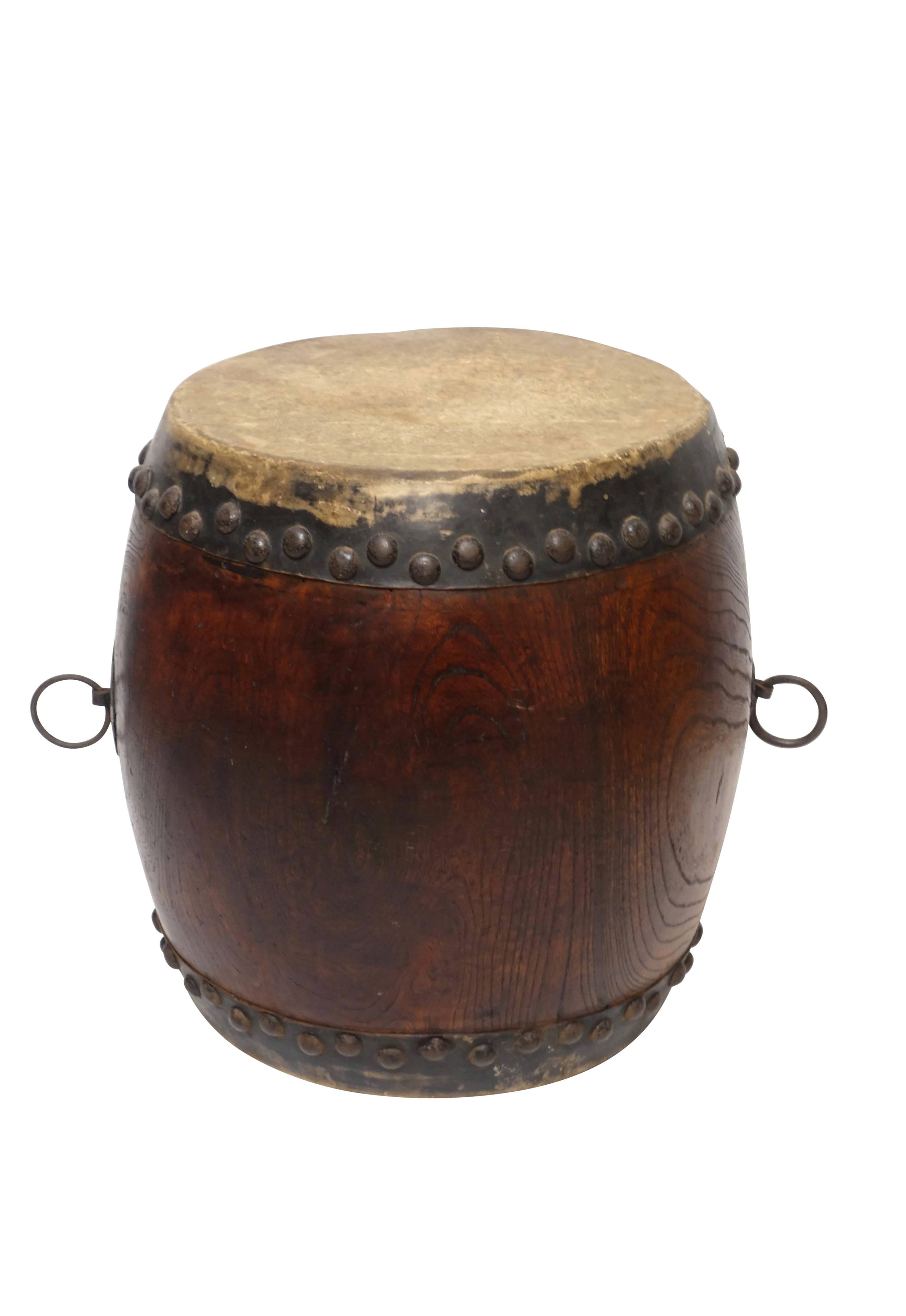 Beautifully grained wood drum with nice iron handles and tacks. In good condition. 
Tanggu drum. The tanggu (??; pinyin: tánggu, pronounced [t????kù]; literally "ceremonial hall drum"; sometimes spelled tang gu) is a traditional Japanese