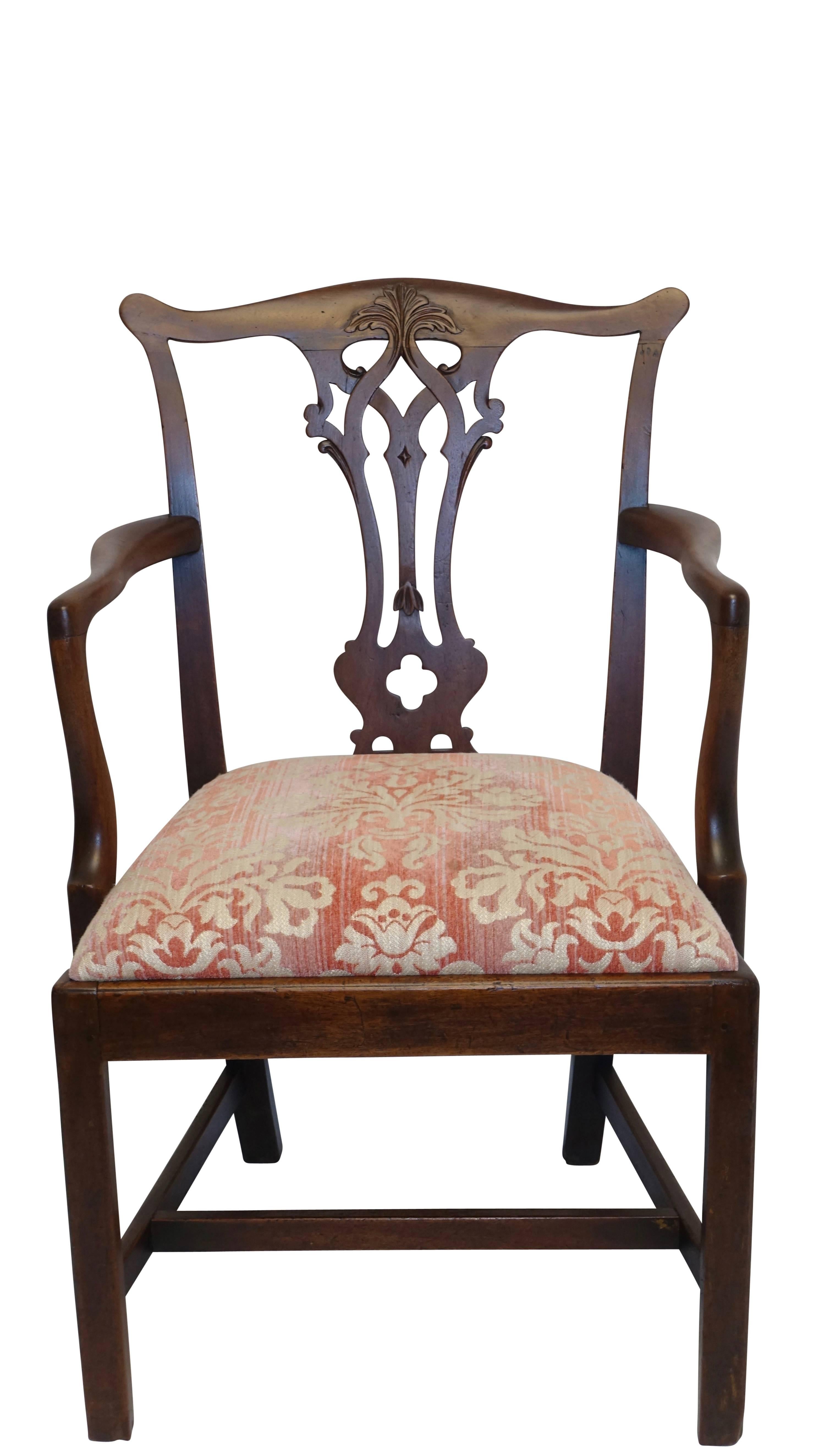 Georgian mahogany ribbon carved back splat armchair with leaf carved shaped crest rail with upholstered drop in seat, English, circa 1820.