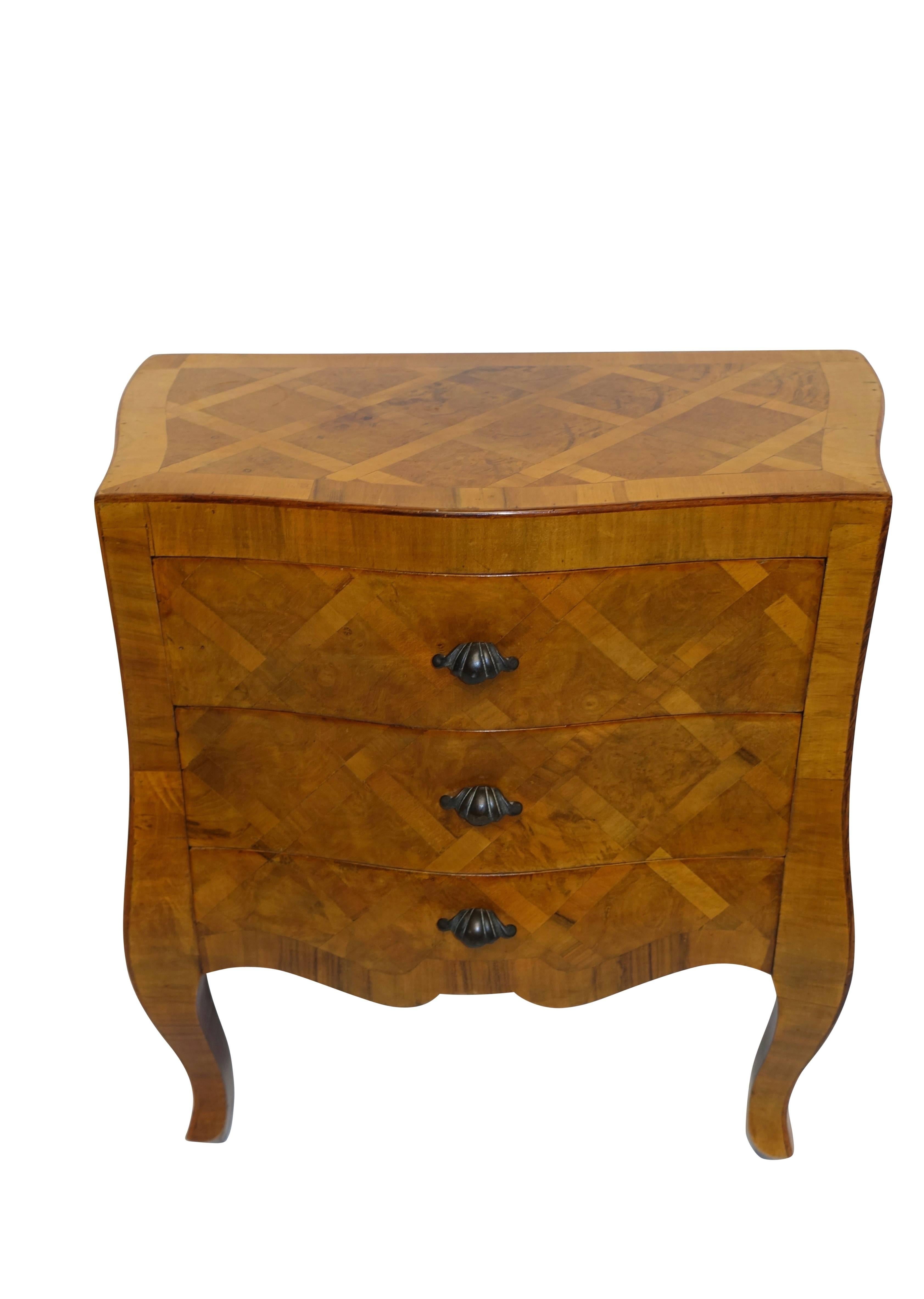 Vintage walnut veneered small chest side table with three drawers and inlaid with a lattice pattern on all four sides. Standing on cabriole legs and bronze patinated drawer pulls, Italian, circa 1960s.