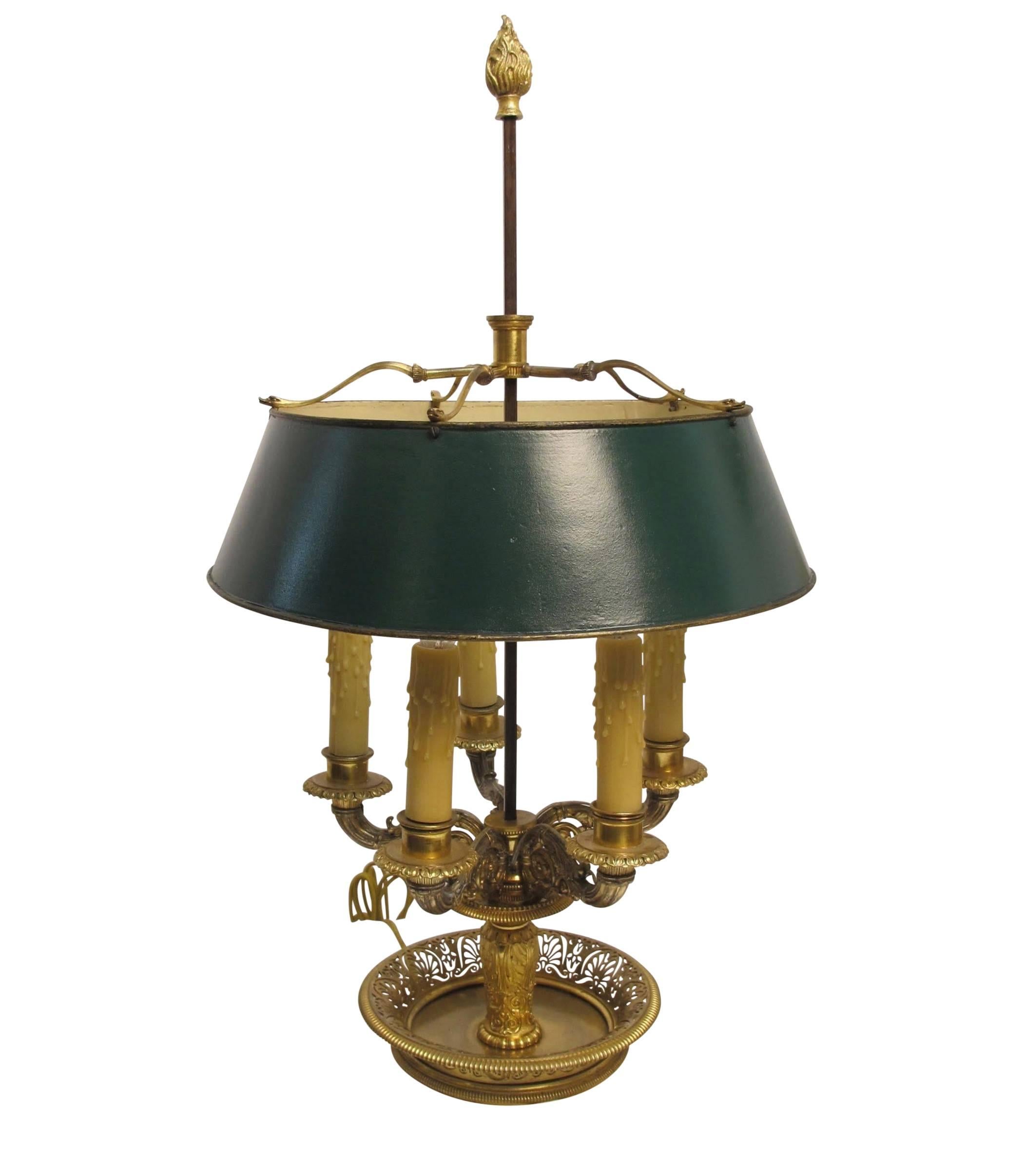 An extraordinary bronze bouillotte table lamp with original gilding and exquisite detail, having a green painted tin shade. Fine quality casting and hand cut open work in the tray. Newly re-wired and reconditioned, France, early 19th century.