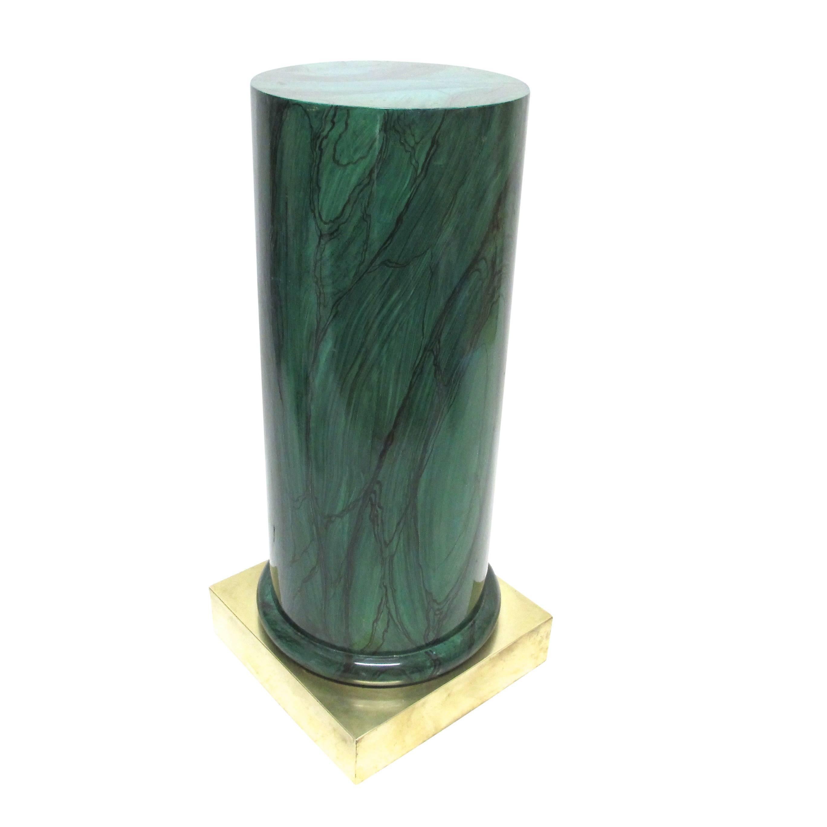 A round pedestal with hand-painted malachite decoration and having a square brass base. American, second half of 20th century.