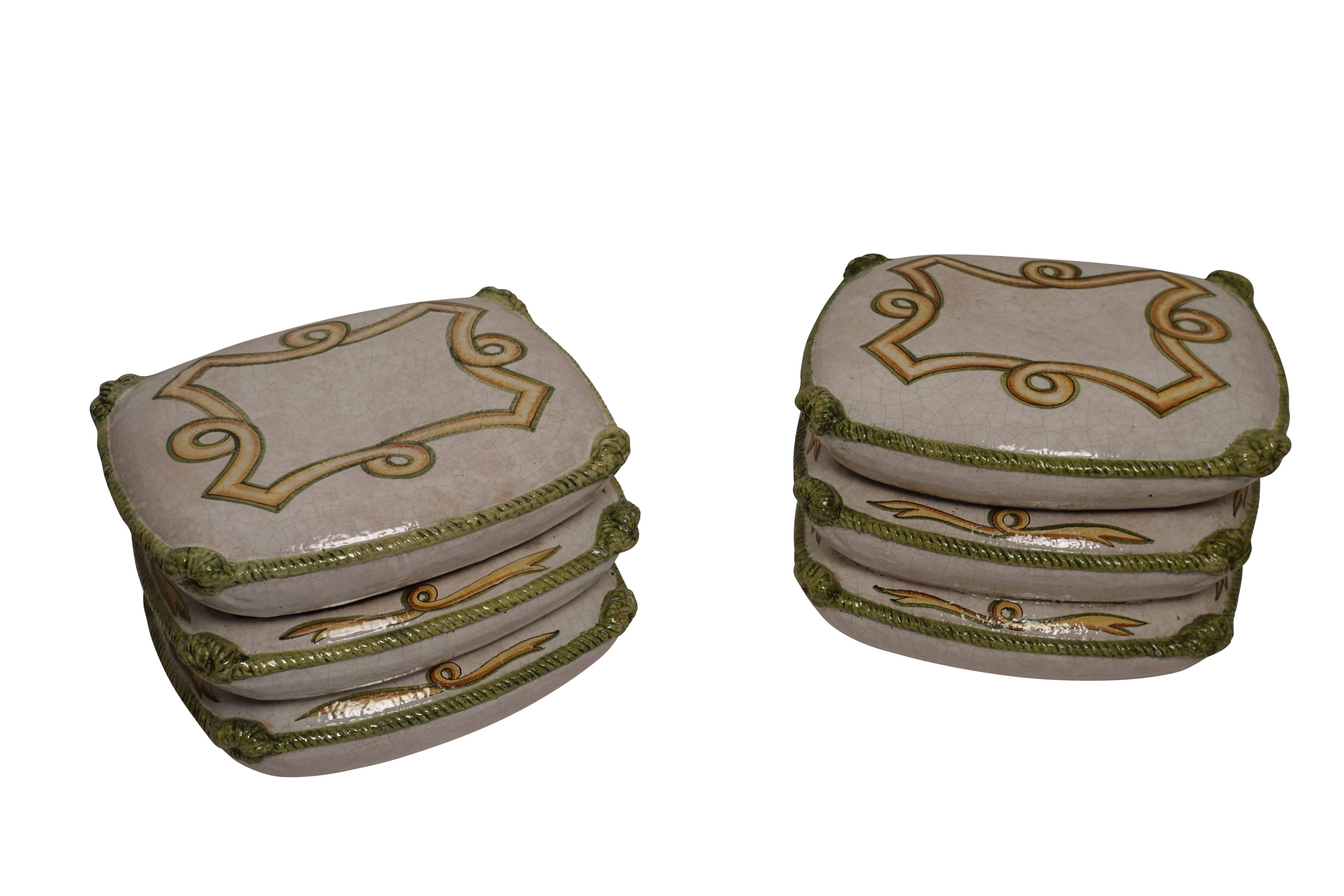 Pair of White crackle glazed ceramic garden stools or tables with a hand painted neoclassical design on the top and edges of the four sides of each cushion with a green glazed rope cording tied in knots on the corners.
Italian, Circa 1970.