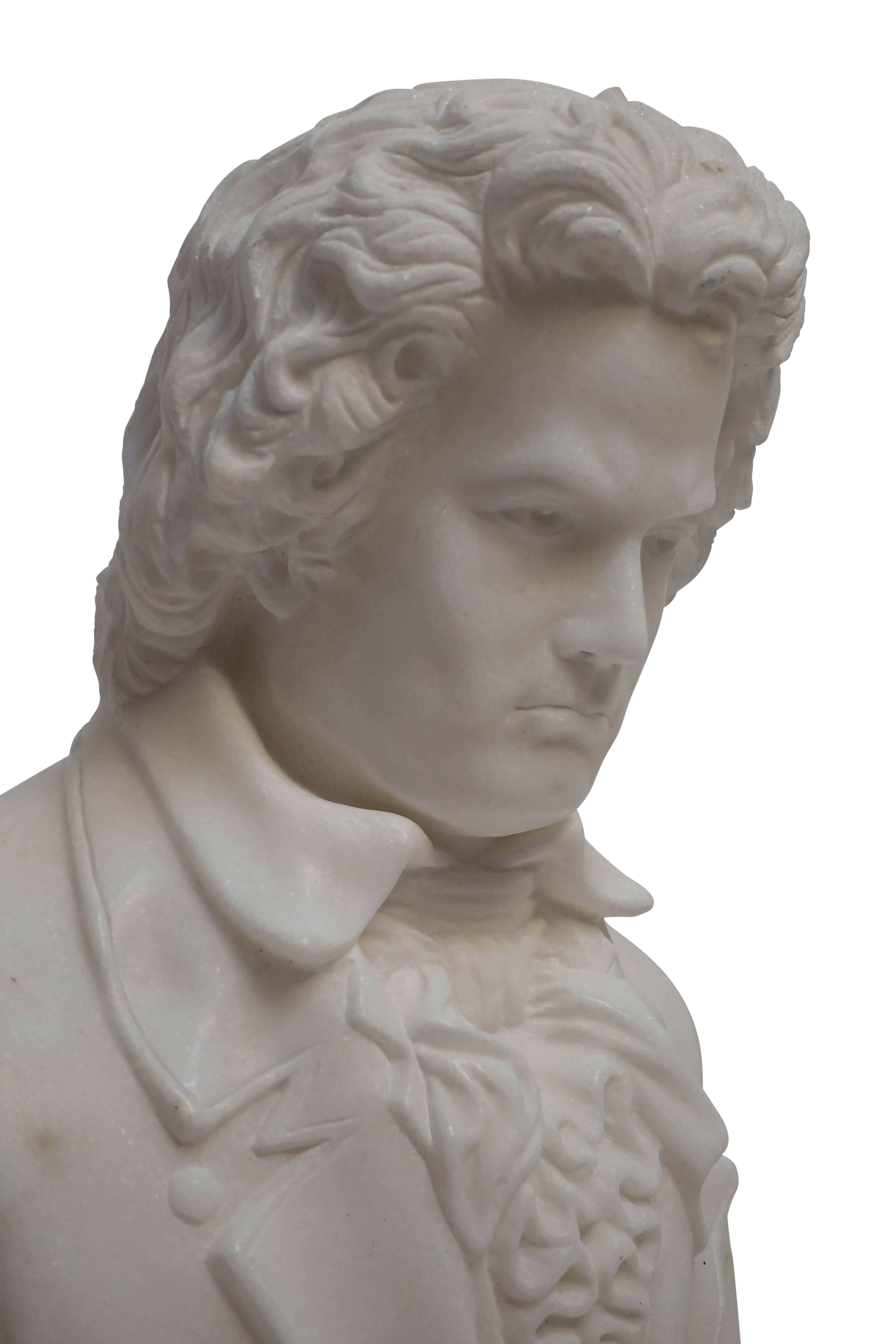 A fine example of a hand-carved Carrera marble bust of Beethoven. Having an interesting matrix on his back shoulder. This bust is half life size, 19th century.