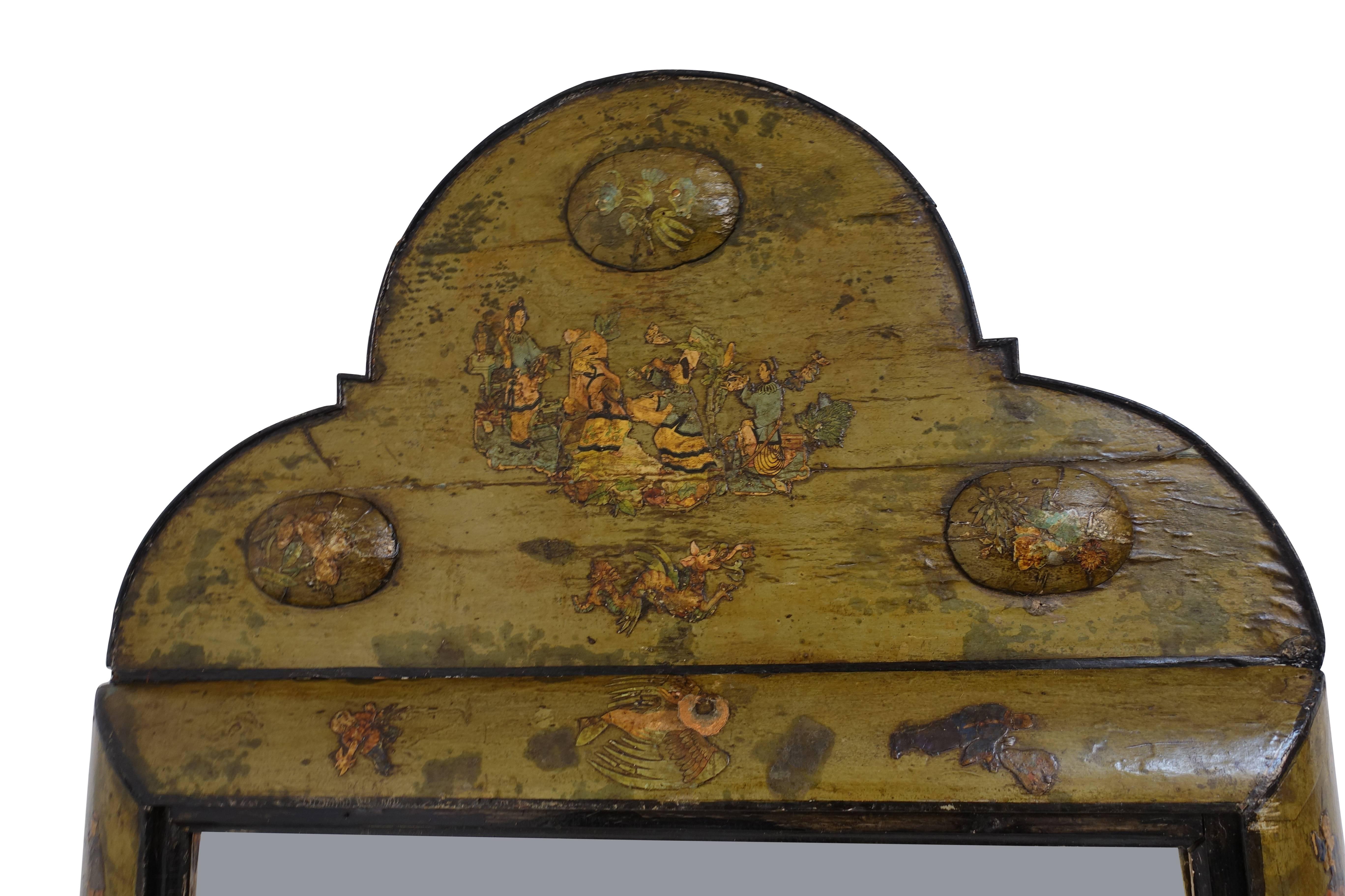 Wonderfully unique green painted and decoupaged mirror with Chinese figures and flowers. Having an arched top above a bold bullnose frame, trimmed with black edging around a beveled glass mirror. Dutch, circa 1800.