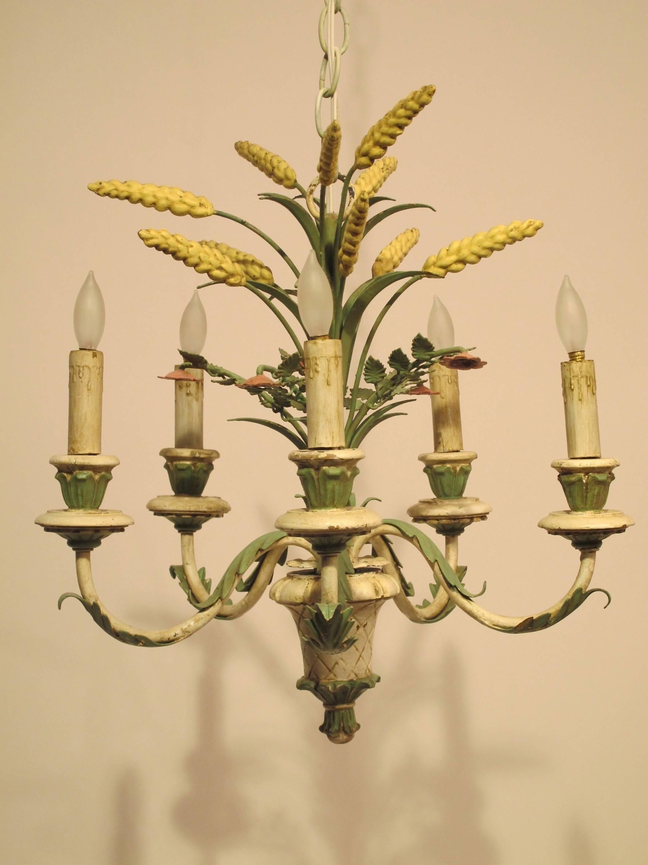 Carved wood with green and white old paint, six arm light fixture with wheat detail. Newly re-wired, holds chandelier size light bulbs. Italian, circa 1950.