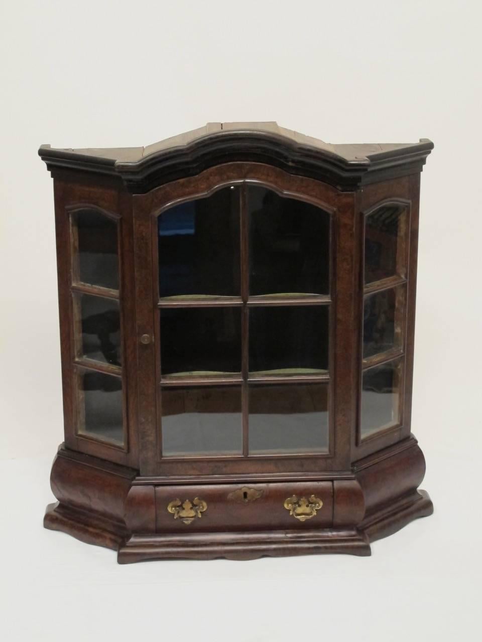 A beautiful quality and perfect scale Dutch made burl walnut and walnut vitrine or cabinet (likely a cabinet maker or apprentice model). Cabinet has painted interior with two shelves and a single drawer. Netherlands, circa 1800.