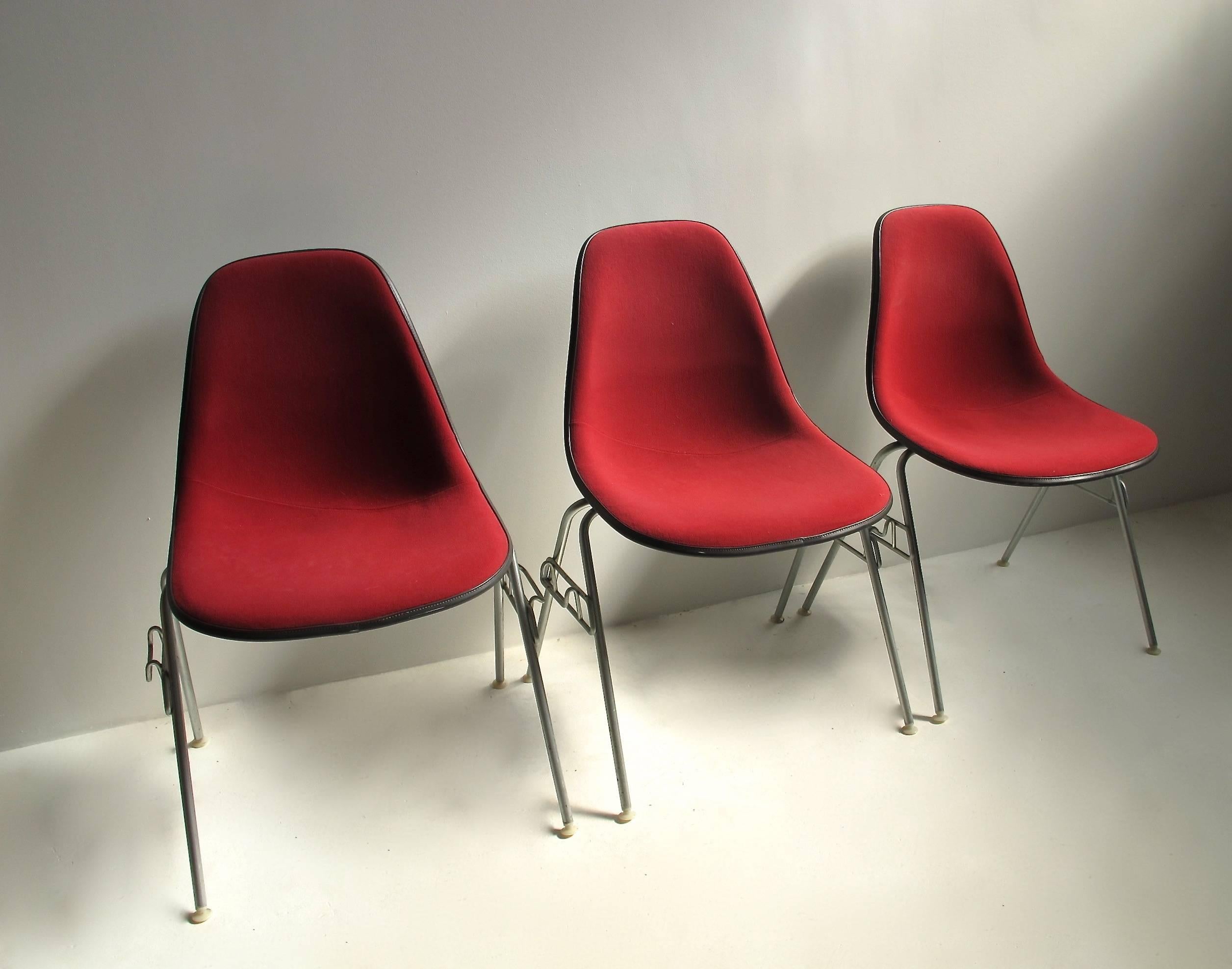 Six upholstered Herman Miller molded fiberglass shell shaped side chairs in original condition.