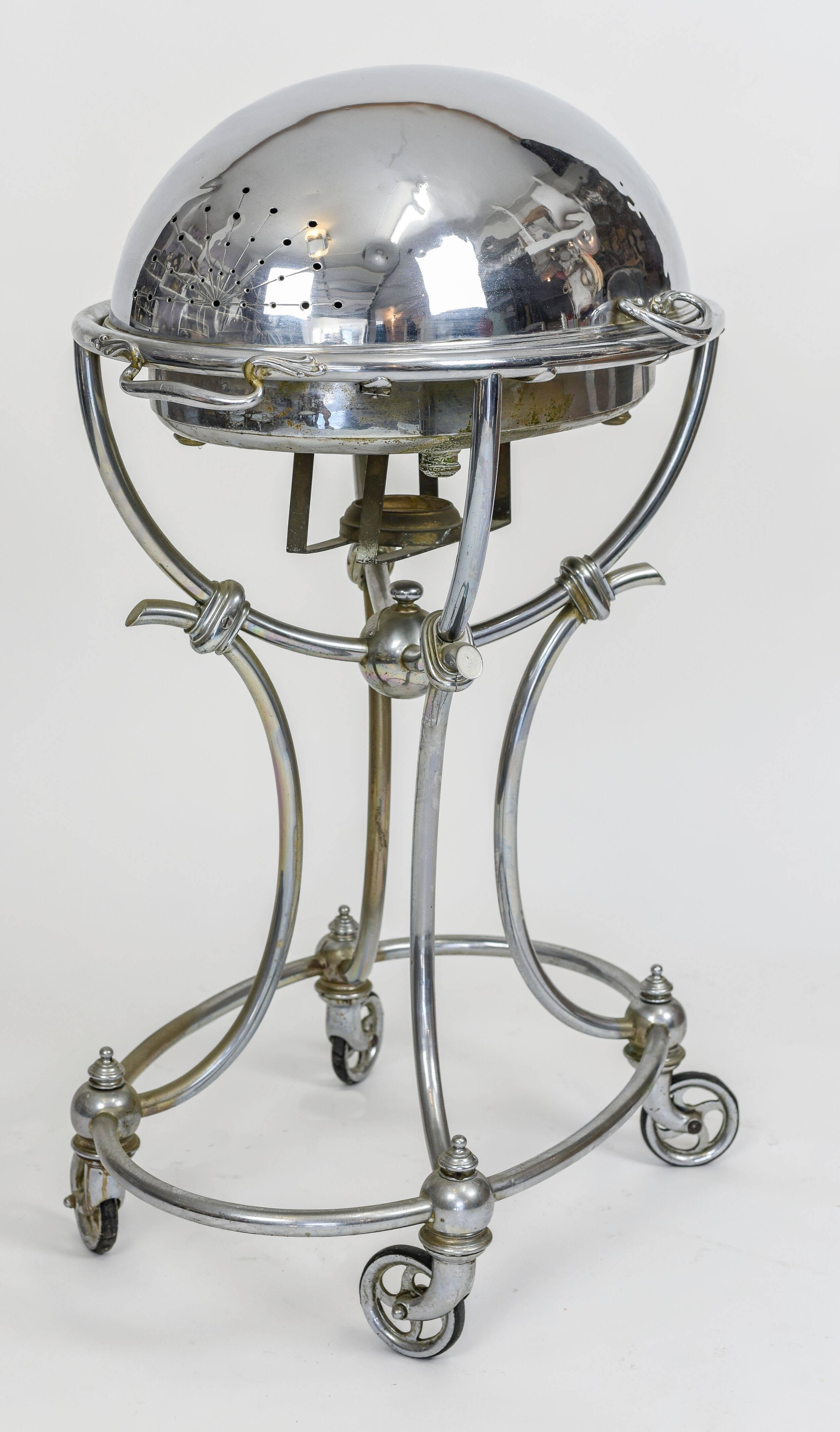 Magnificent silverplate carving trolley, from one of the finest silversmiths, Broggi, Italy.

From the late 19th century to the late 1930s, carving trolleys would be placed at the entrance of hotel or restaurant dining rooms so guests could view