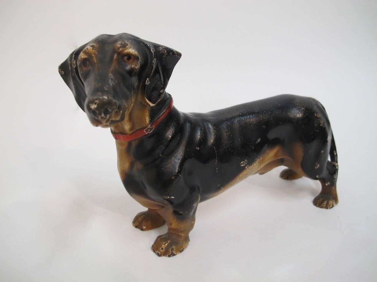 An early cast iron doorstop with original paint of a Dachshund dog, marked Made in U.S.A.