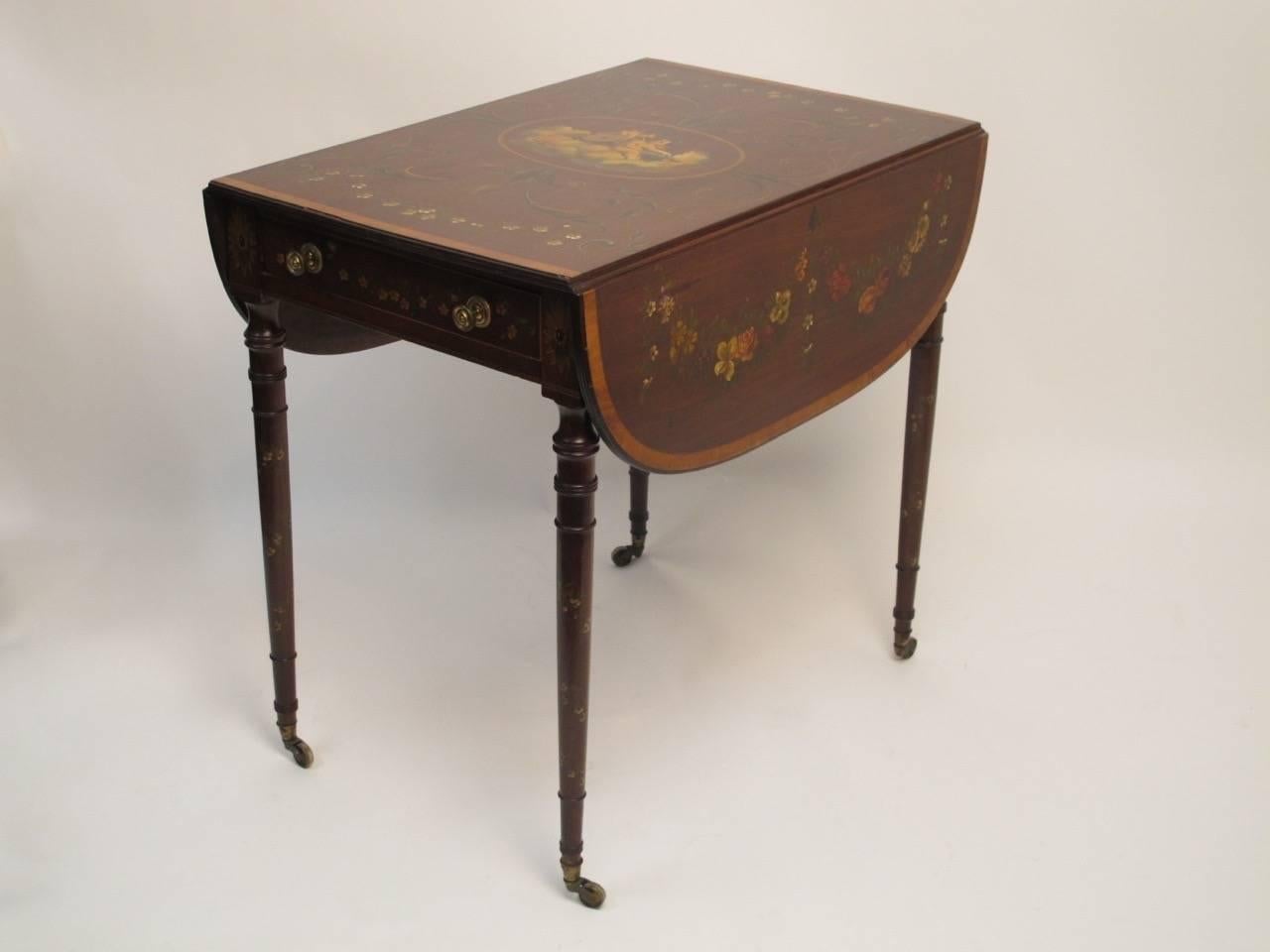 19th century mahogany pembroke table with hand painted floral decoration, satinwood banding around the top and two drop leaves. Each leaf measuring 10.5 inches wide. England, circa 1880.