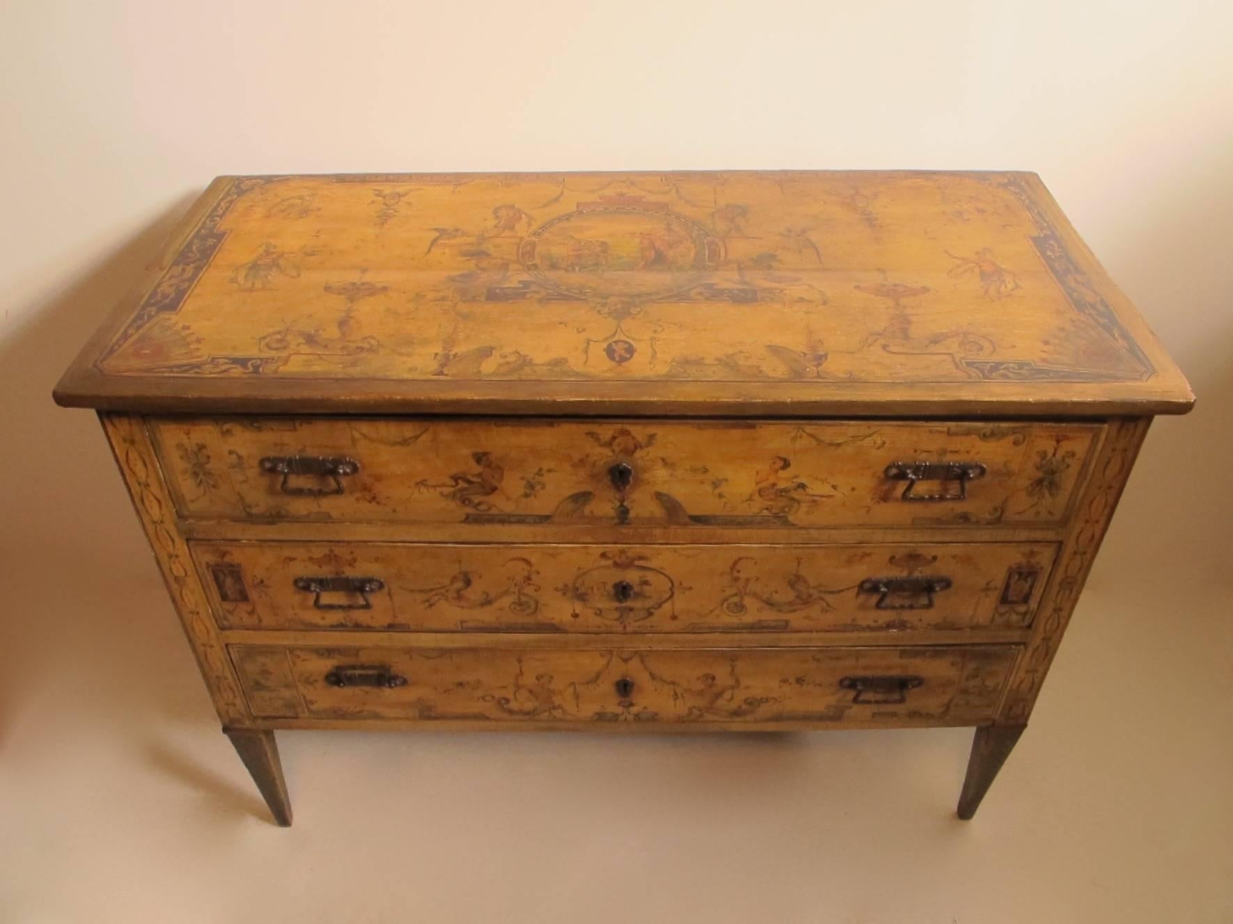 An Italian Renaissance style hand-painted three-drawer commode with later hardware. Decorated throughout with great detailing, showing the Medici Family Crest or Coat of Arms, and each drawer lined with wonderful old Italian paper, Italy, late 17th
