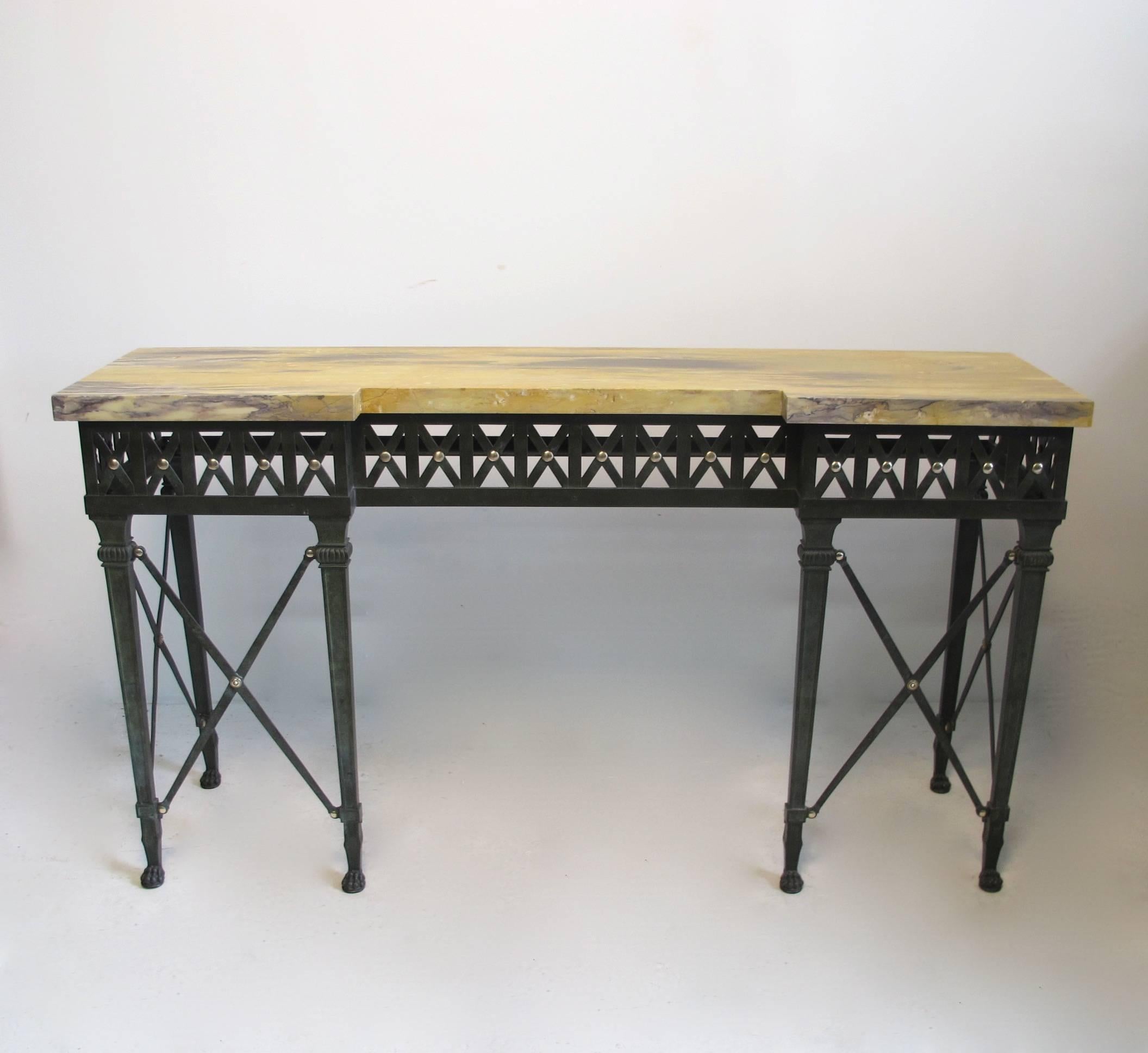Bronze and iron neoclassical style console table with original marble top and beautiful old patina. Marble top shows expected signs of age and wear with some old repairs.