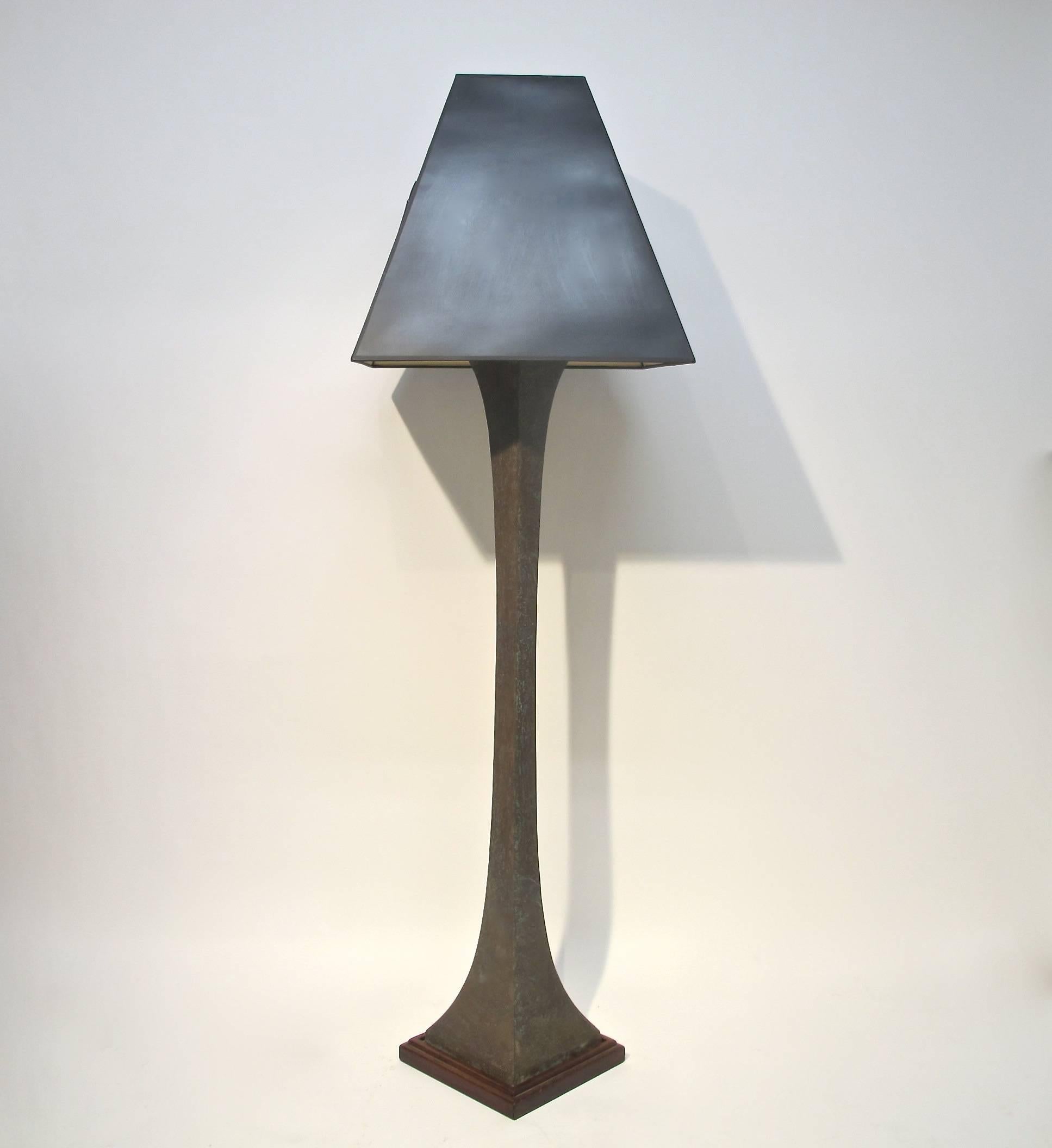 Sculptural Patinated Bronze Square Floor Lamp sitting on a rosewood plinth base by Lawerence & Scott.  This iconic design was featured in several of Maison Jansen interiors in the 1960's.  American, Circa 1970's.  
Shade only for photo not included.