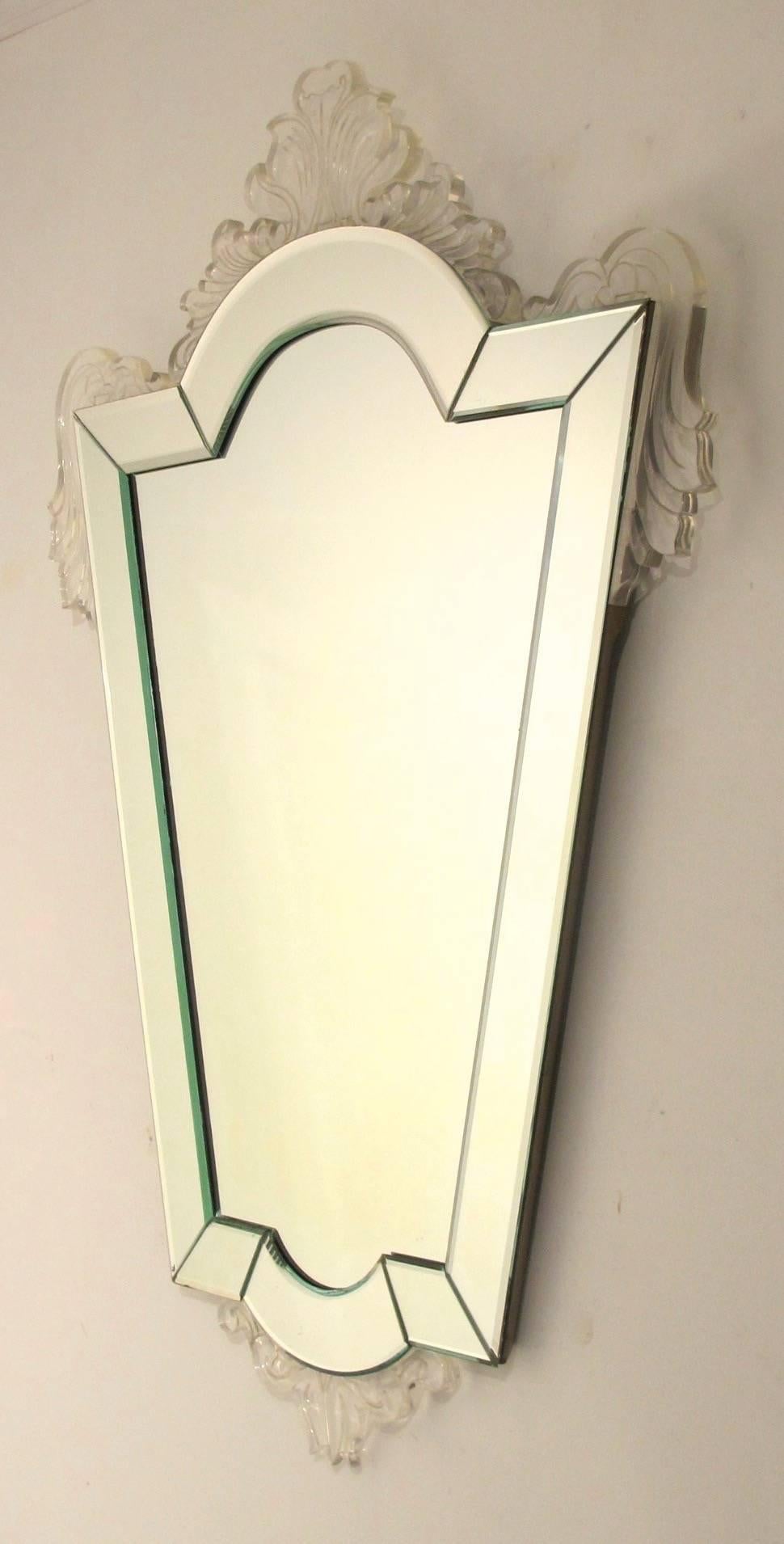 An unusual Venetian style mirror with Lucite floral accents, American, 1940s-1950s.