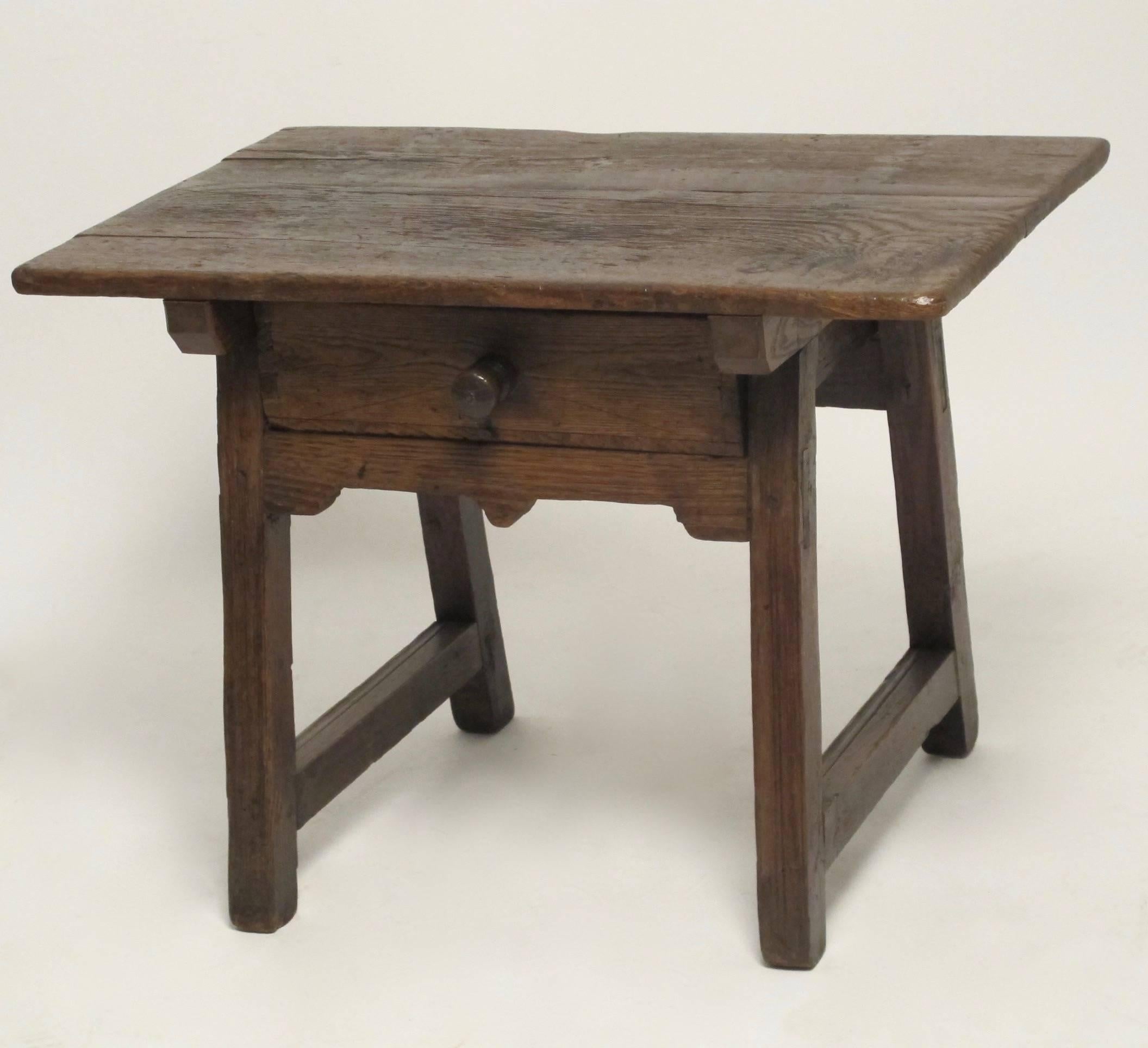 Mesquite side table with a single drawer and having original two board top. Mexico, 19th century.