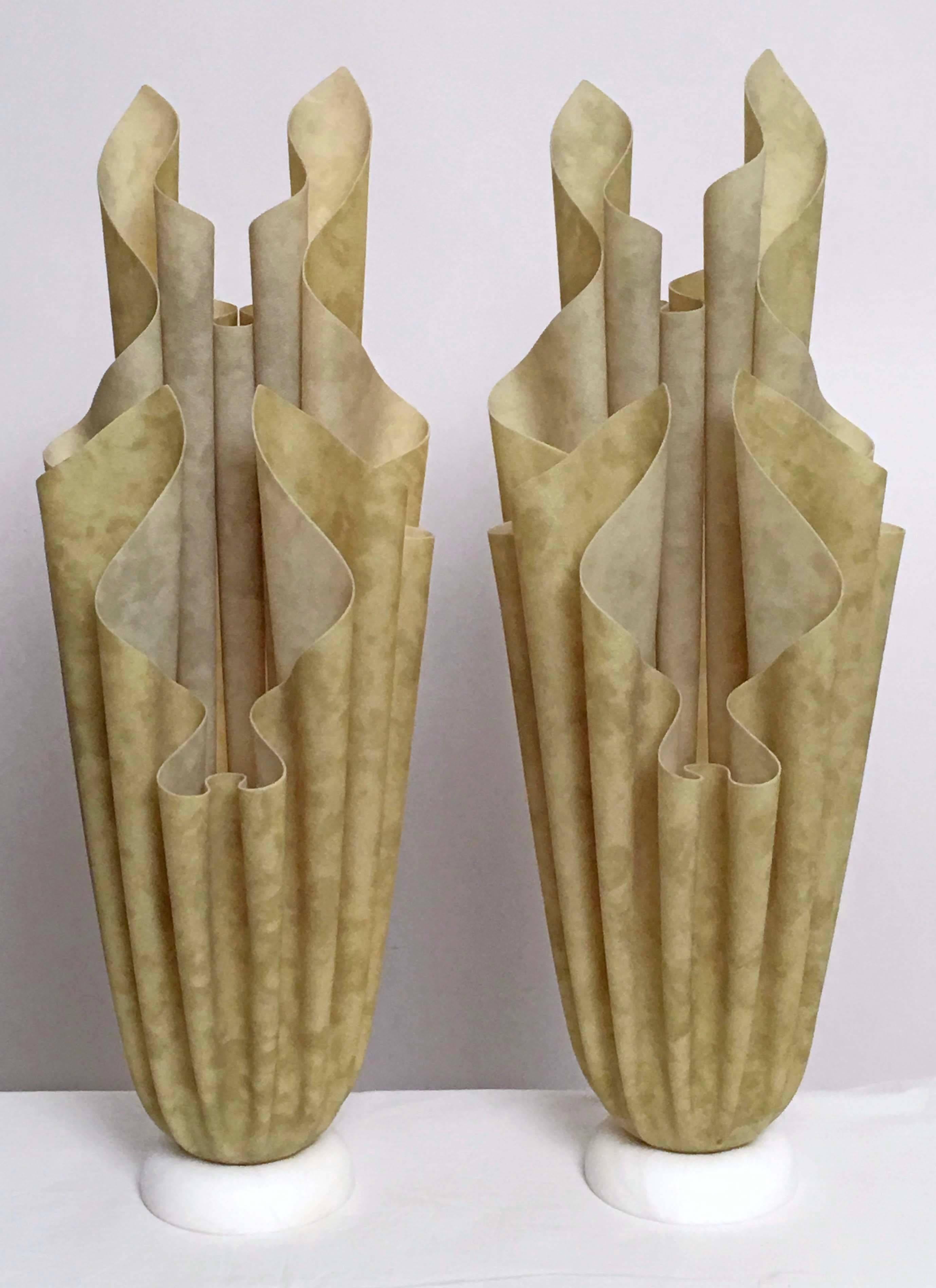 Vintage 1970s pair of resin covered fabric lamps created by French designer Georgia Jacobs. The undulating forms sit on an alabaster base and create a beautiful glow when lit. 
Athena labels are affixed to the bases and lamps are wired to US