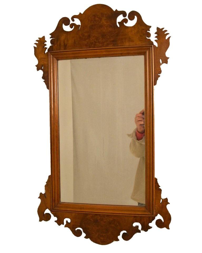 An early 20th century burled walnut mirror in the Chippendale style. 