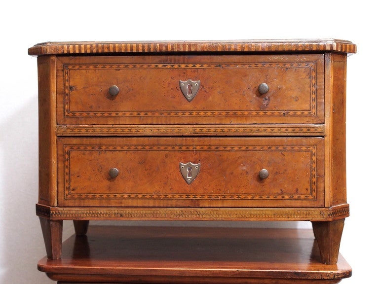 A lovely 18th century tabletop commode, having two drawers and with canted corners over tapered feet.