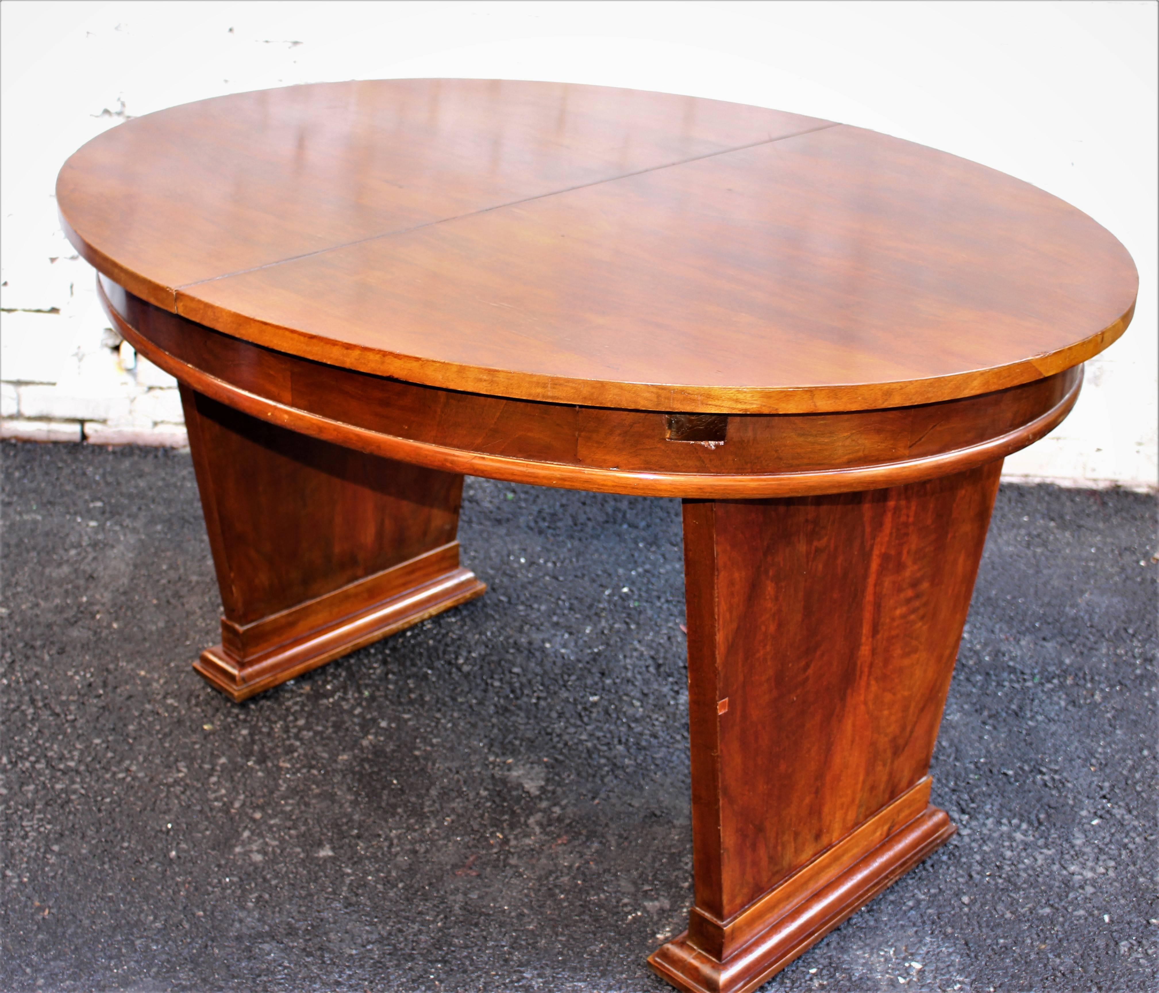 1930s French Art Deco table and two chairs table suppose to have extension in the middle but we do not have it. Walnut veneer  and walnut base.