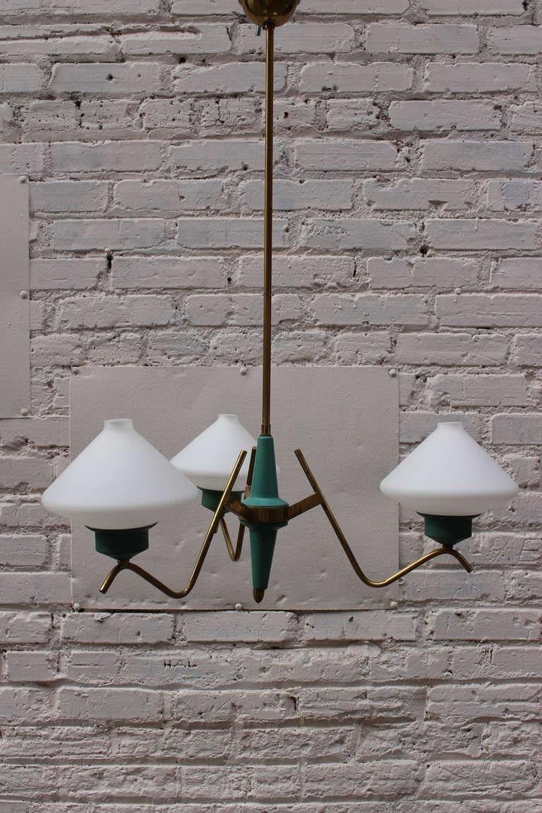 Italian chandelier, tree white opaline glass shades, brass base.