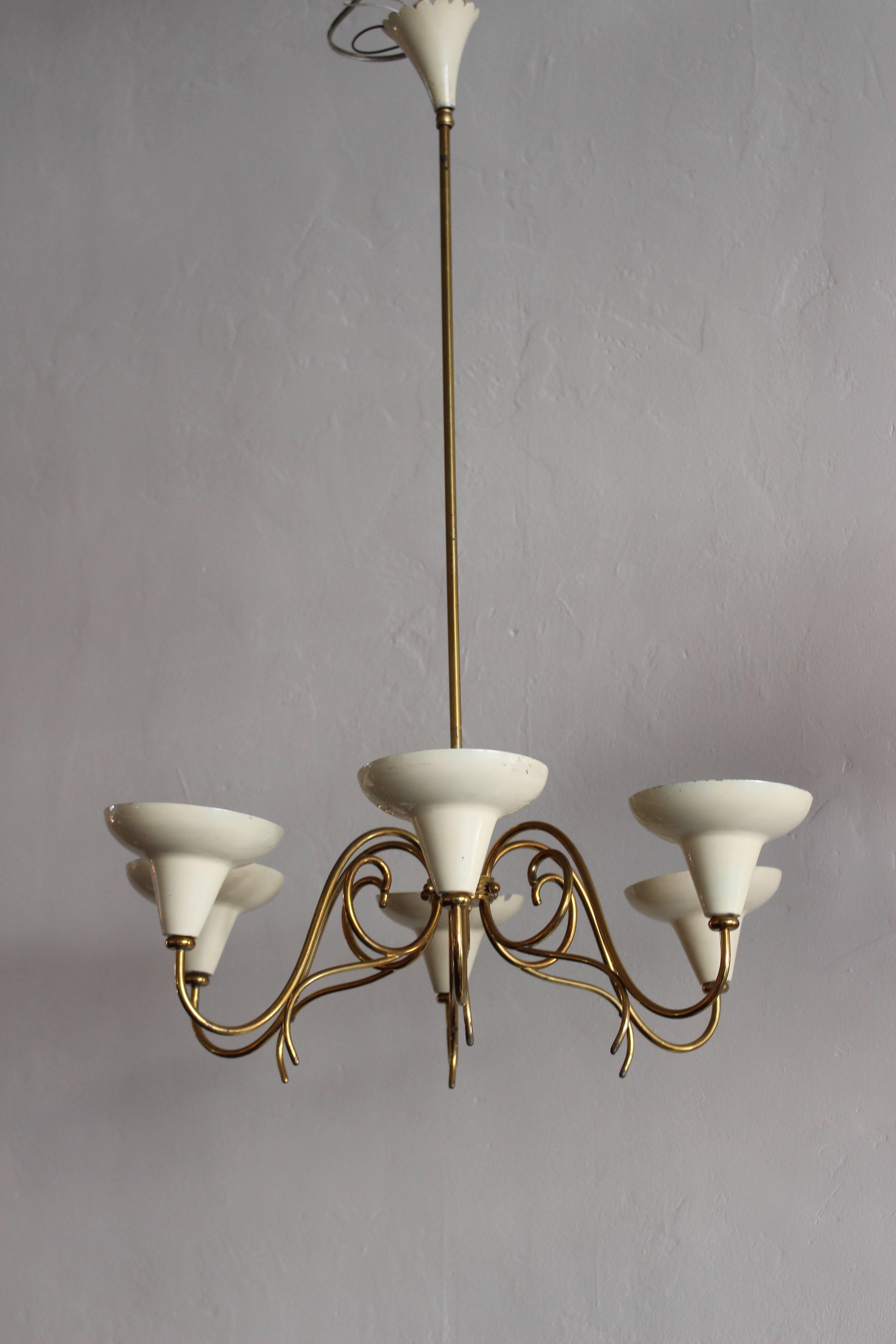 Italian 1950s chandelier with cream shades and the brass base .

