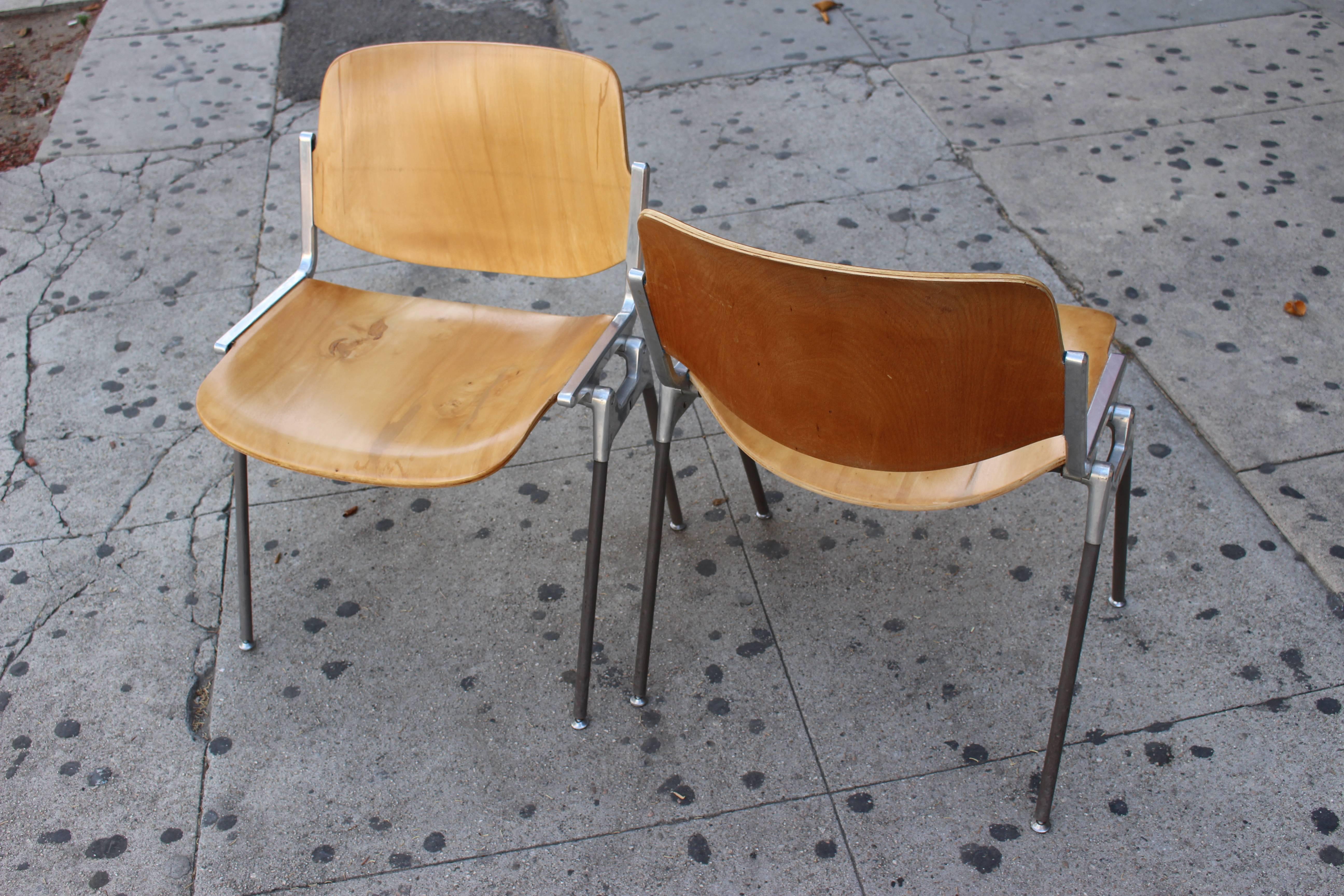 Four stackable Italian chairs. Frame polished aluminum; the legs are coated in plastic. The sitting surface and backrest made from the bent plywood. 
 Only four chairs on sale.

