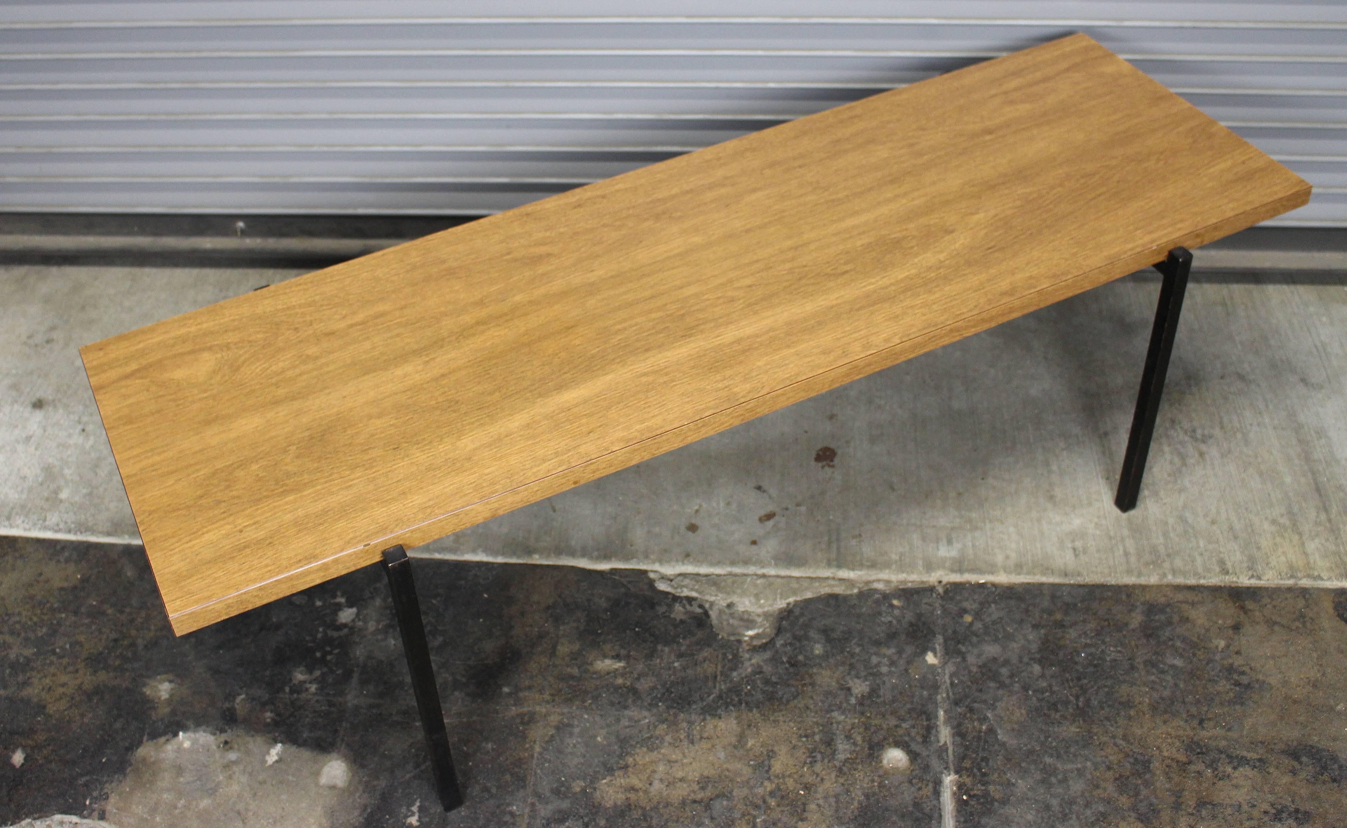 Metal base and wood coffee table.