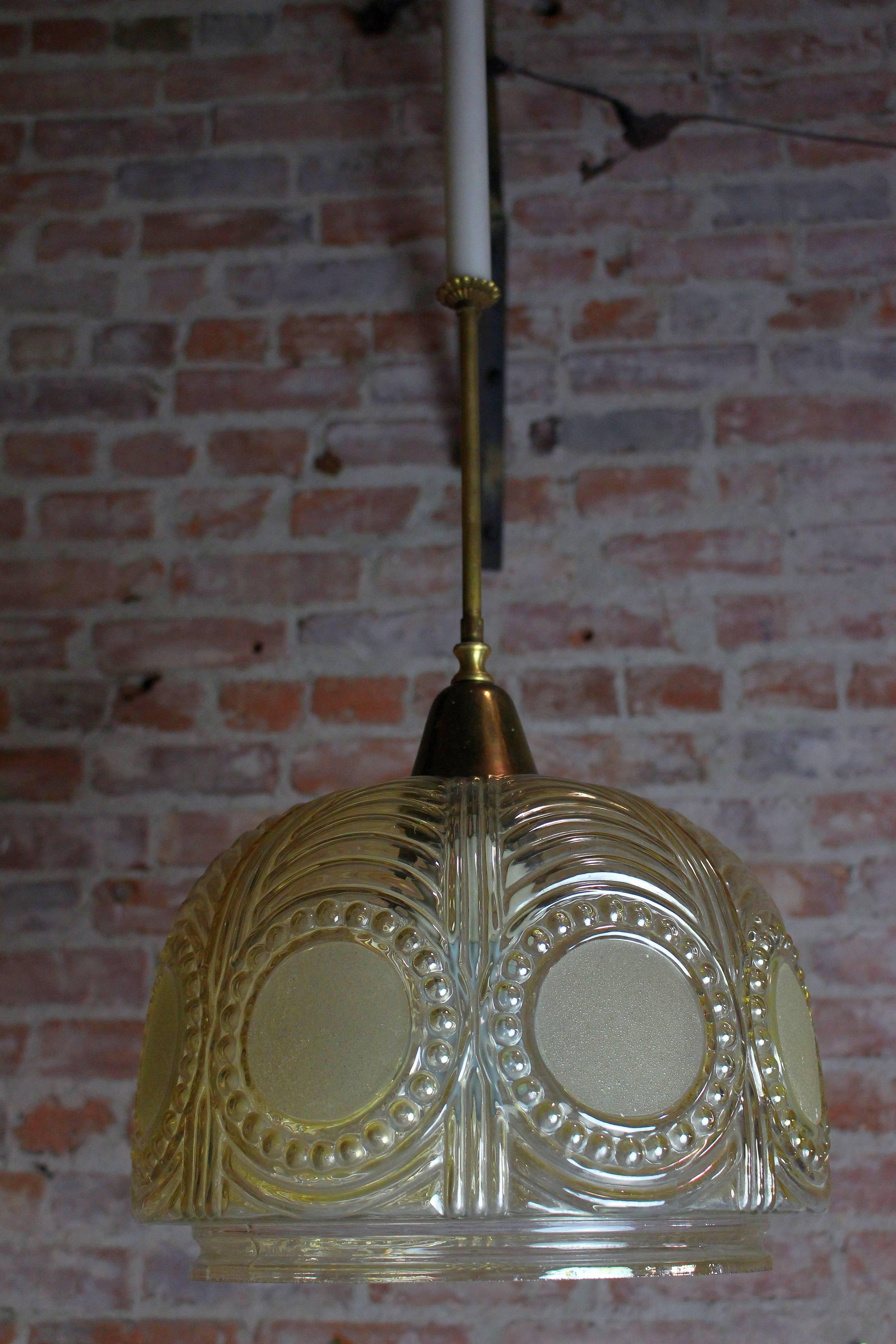 French Art Deco brass pendant with the relief fume glass.