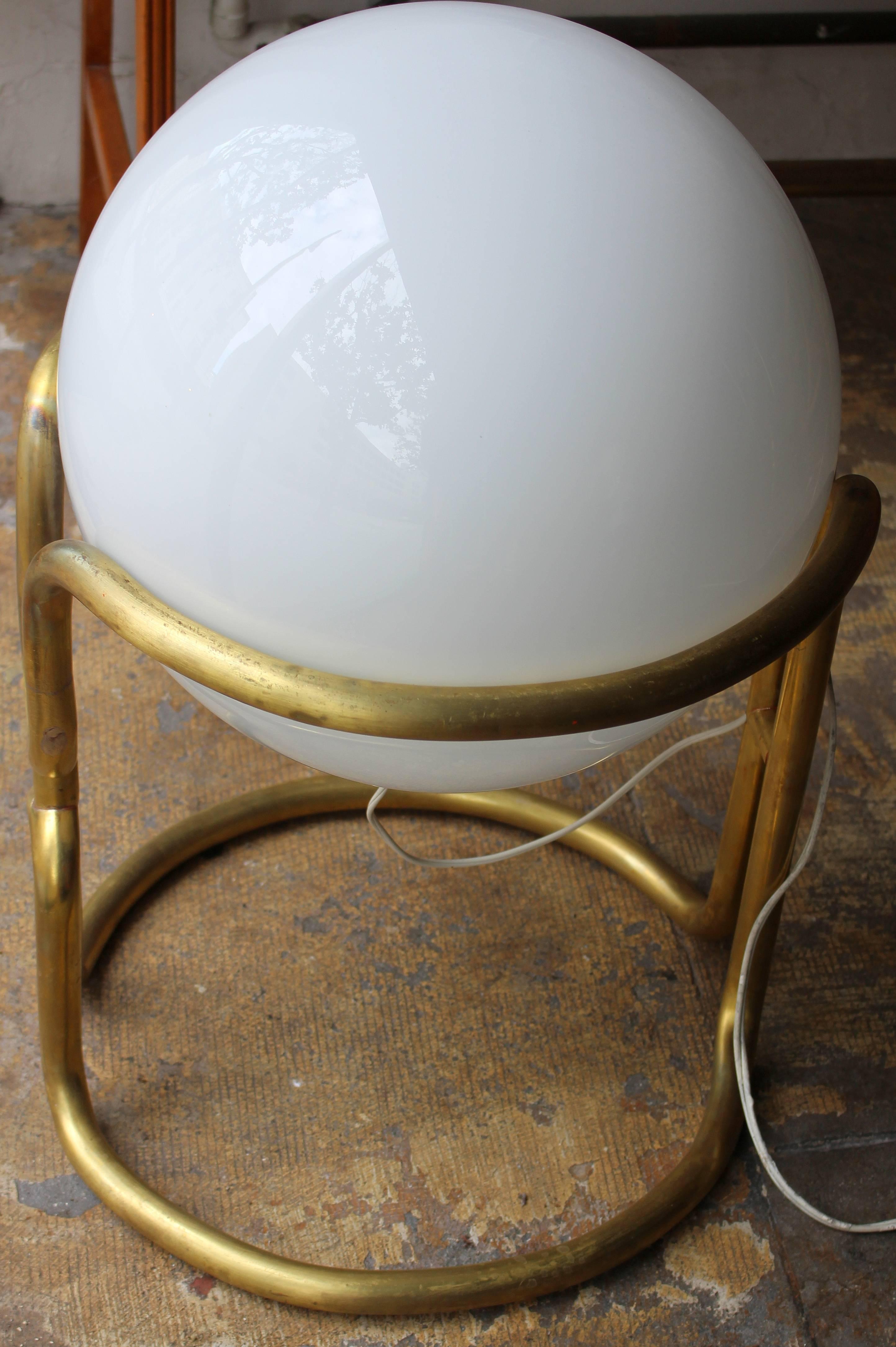 Italian brass floor lamp inspired by Stilnovo design. Brass base and white opaline glass. It could be a very large table lamp.

Item is at the Beverly location
7274 Beverly Blvd 
Los Angeles, CA 90036.
  