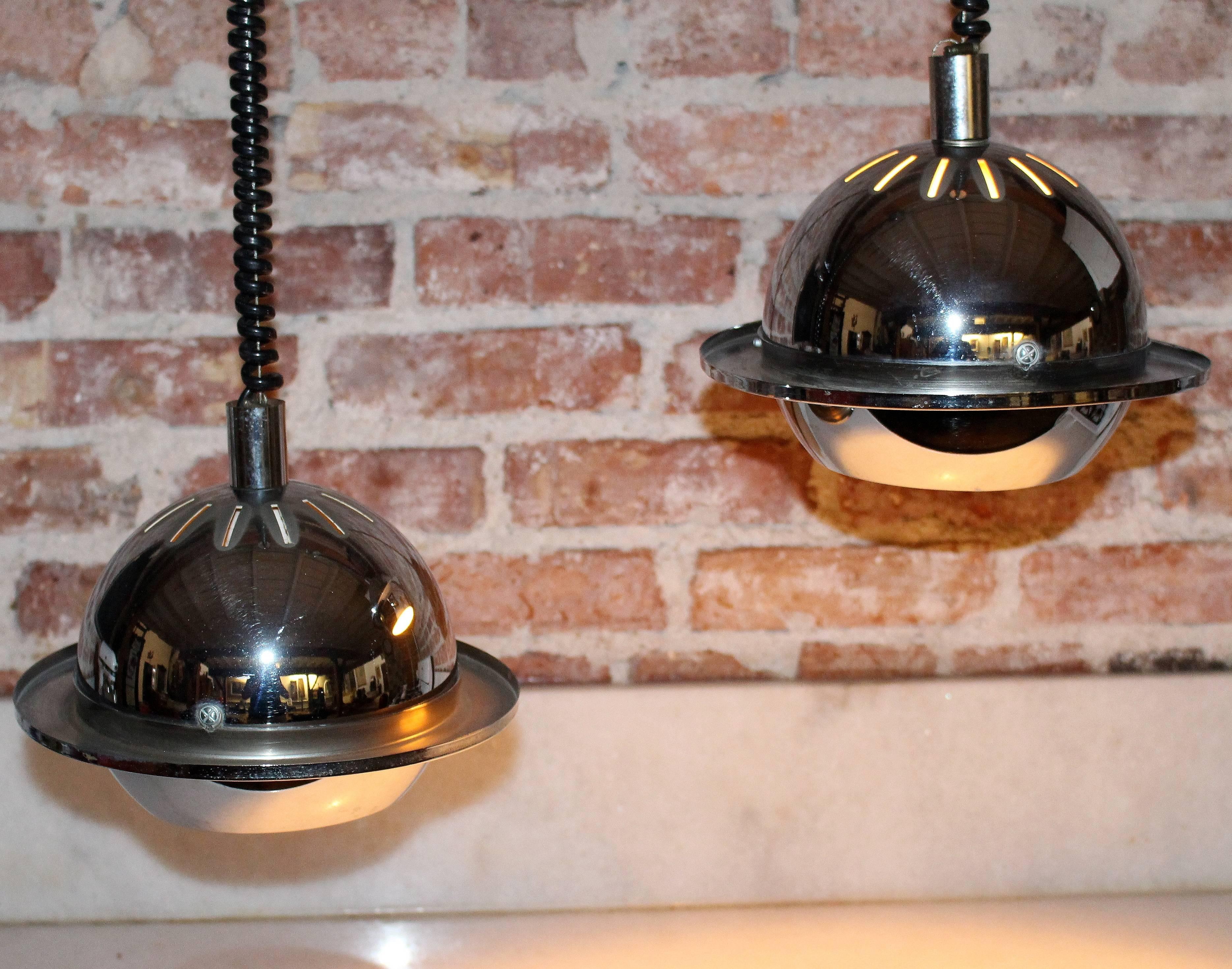 Pair of chrome globe Italian pendants .Adjustable height extended drop is 40 inches .Italian par of pendants in style of Reggiani.