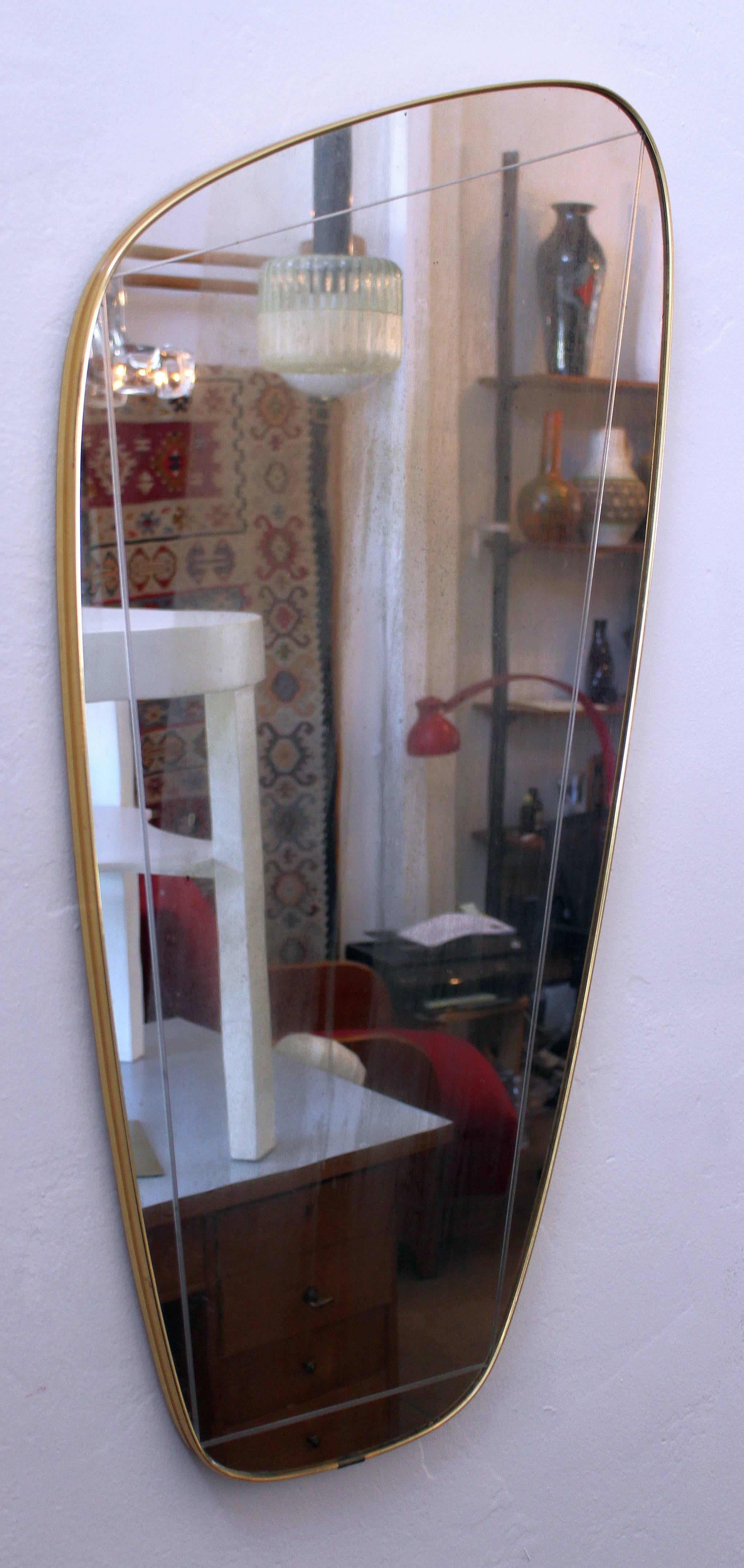 Italian 1950s brass frame and original beveled mirror.